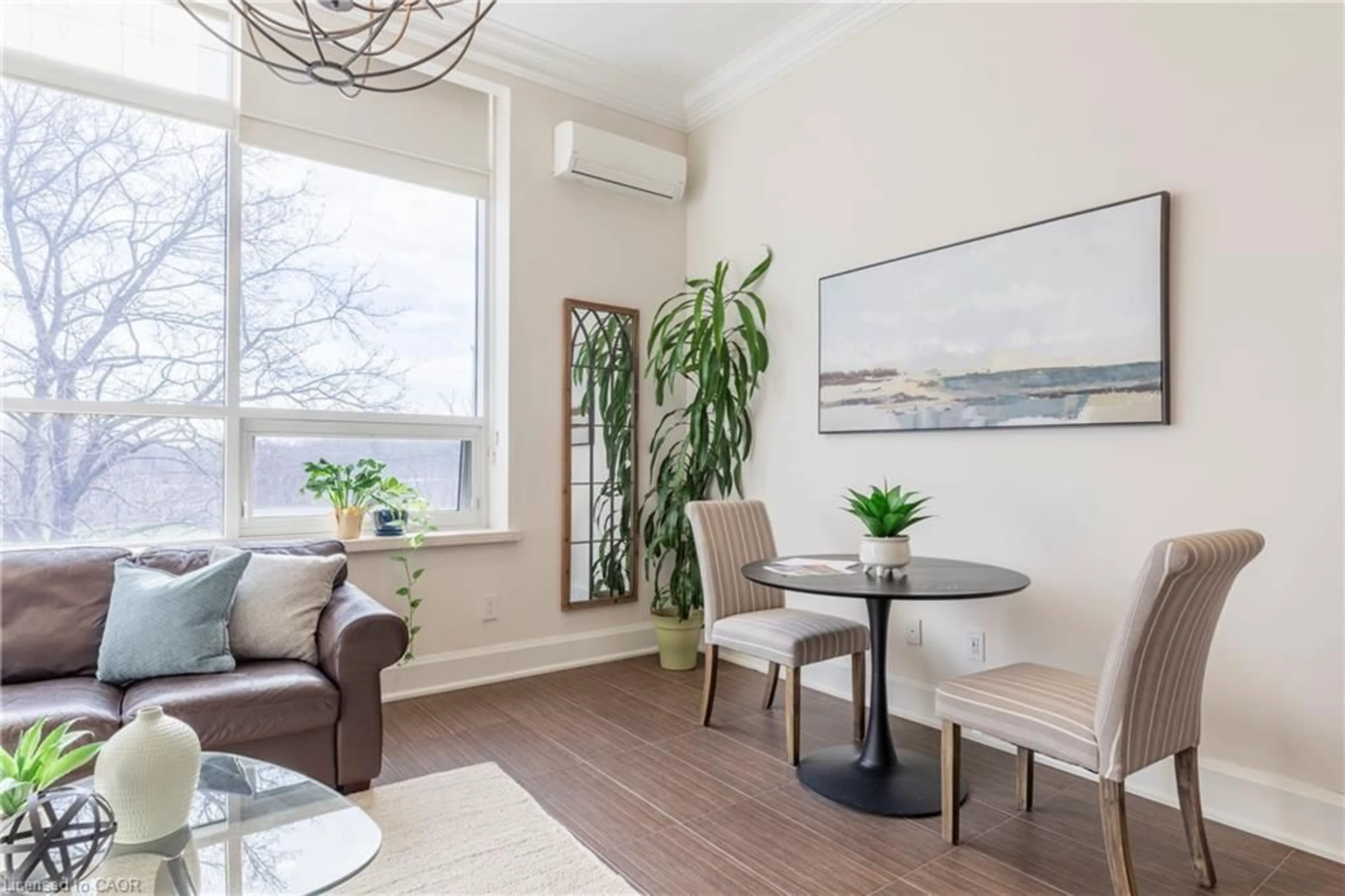 Living room with furniture, wood/laminate floor for 397 King St #207, Dundas Ontario L9H 1W9