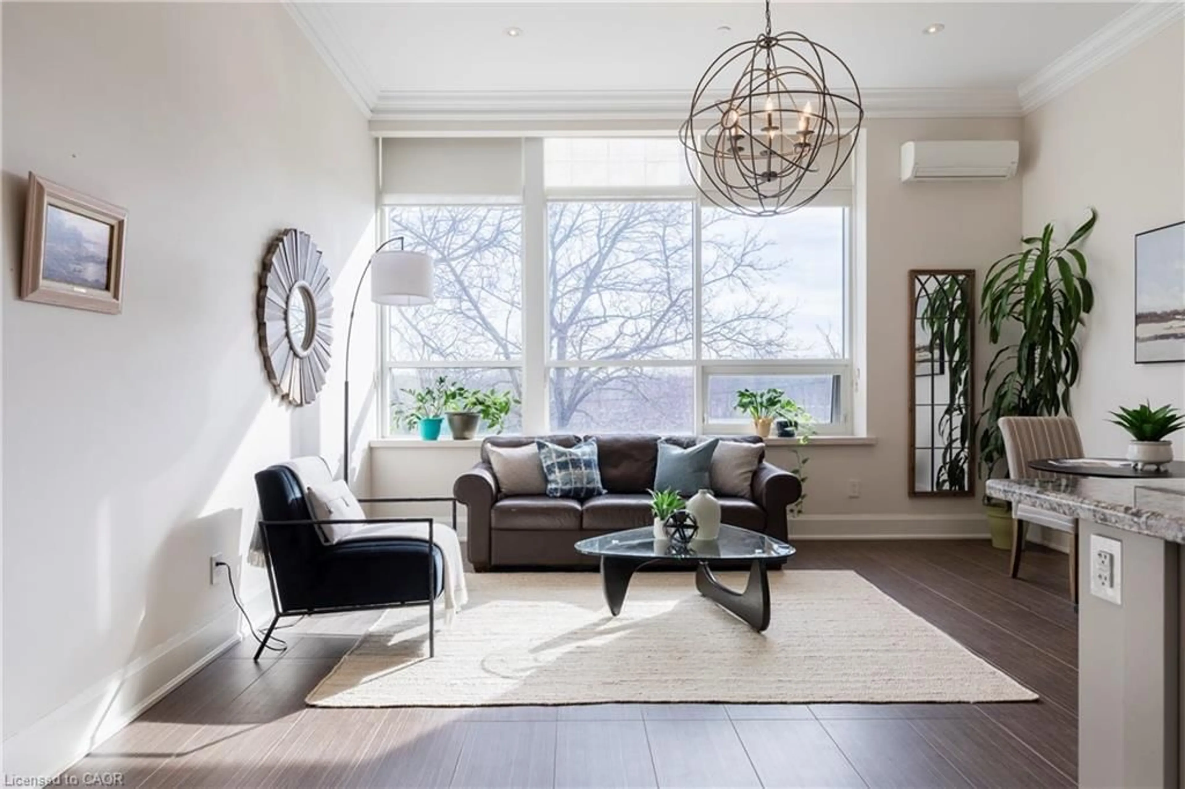 Living room with furniture, wood/laminate floor for 397 King St #207, Dundas Ontario L9H 1W9