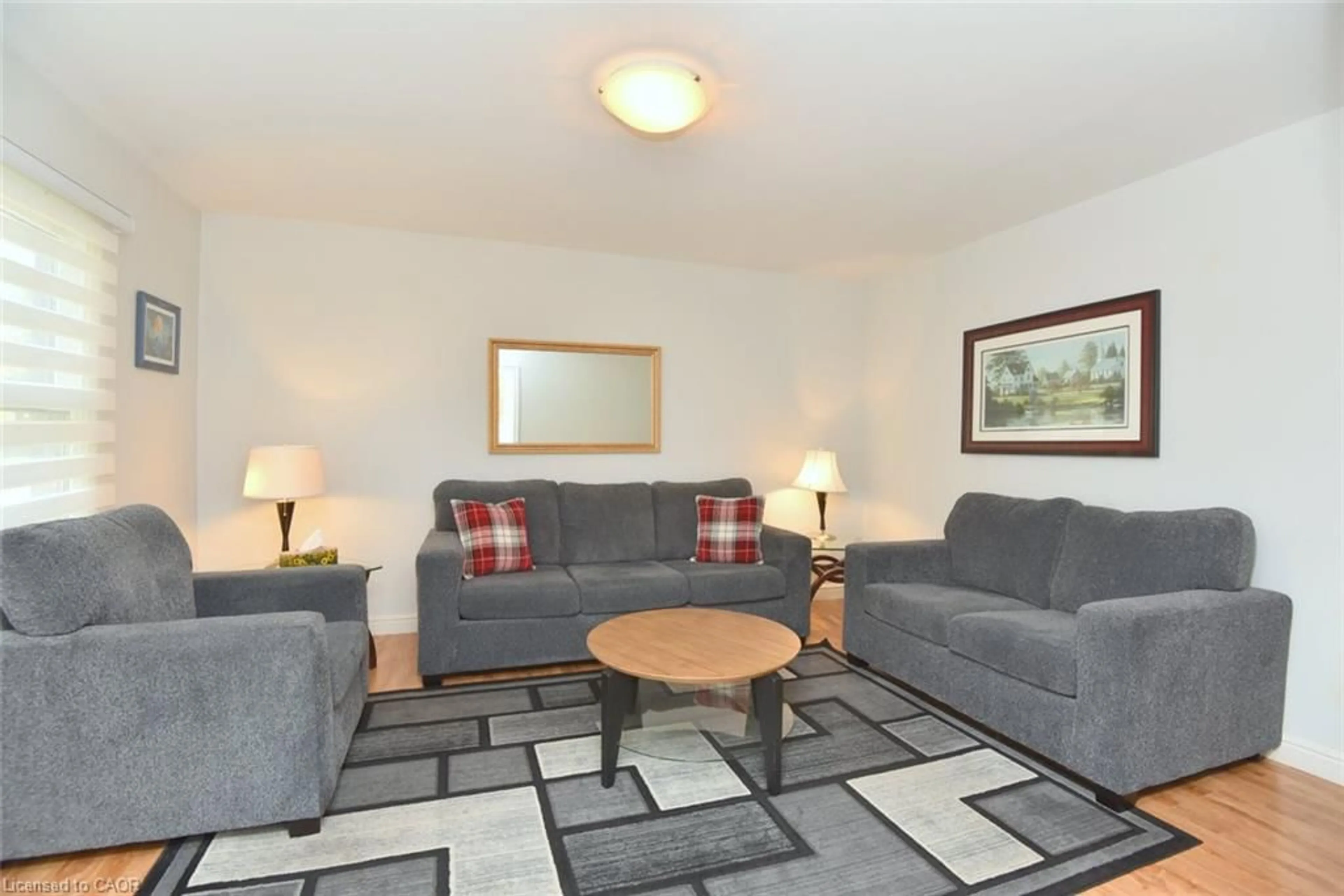Living room with furniture, carpet floor for 161 Julian Ave, Hamilton Ontario L8H 5R8