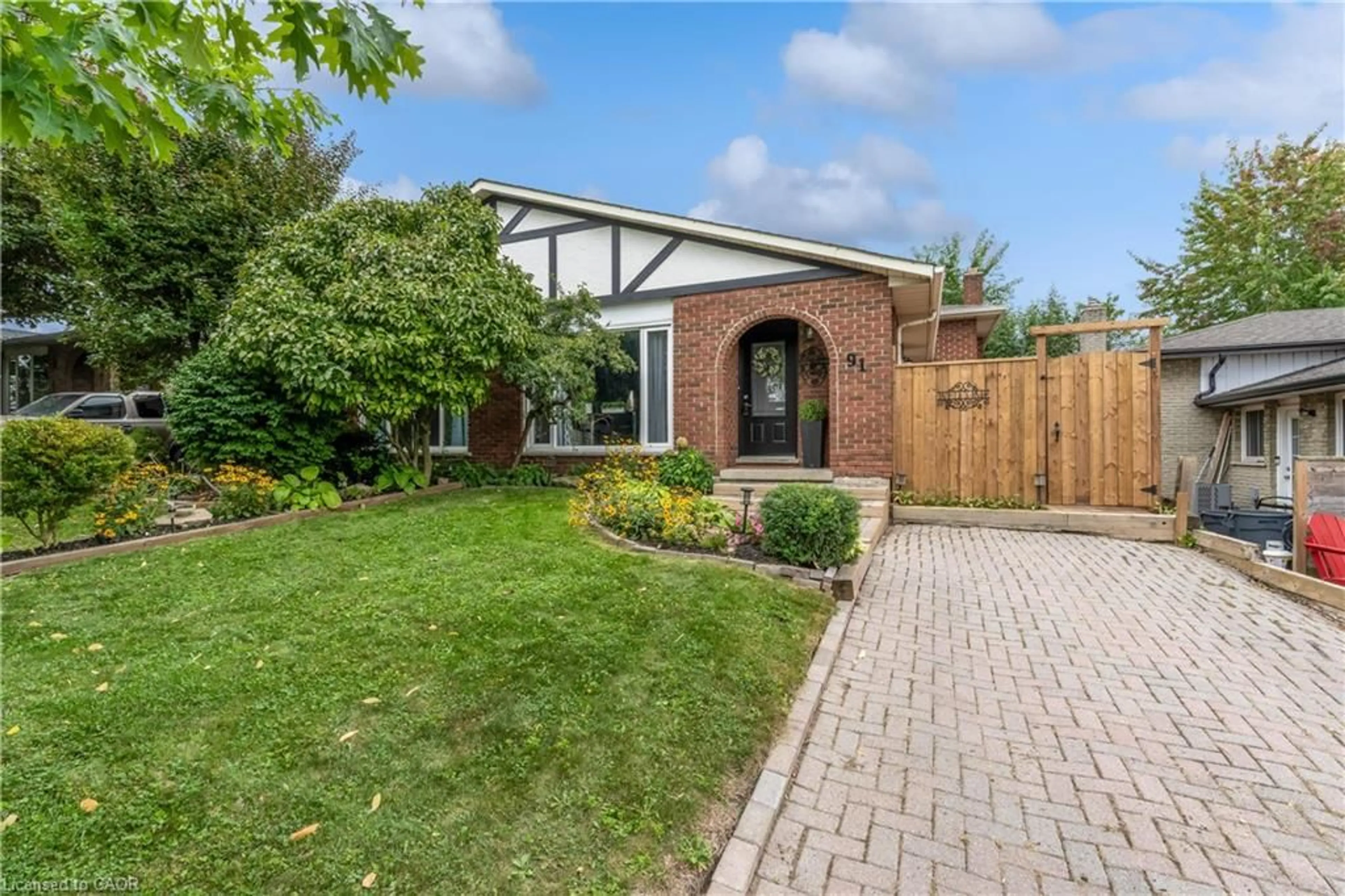 Home with brick exterior material, street for 91 Guildwood Dr, Hamilton Ontario L9C 6S3