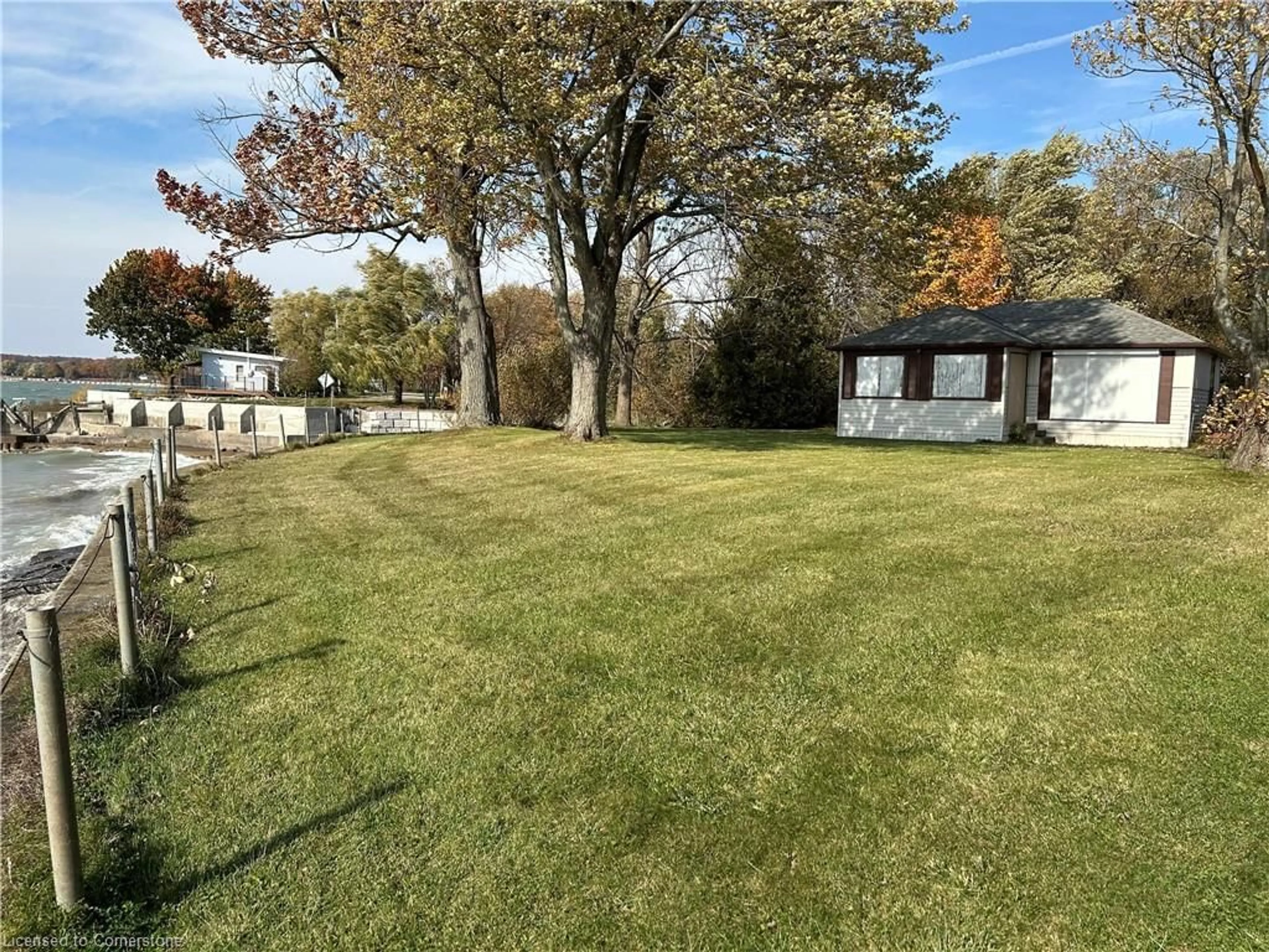 Frontside or backside of a home, the fenced backyard for 3076 Lakeshore Rd, Dunnville Ontario N1A 2W8