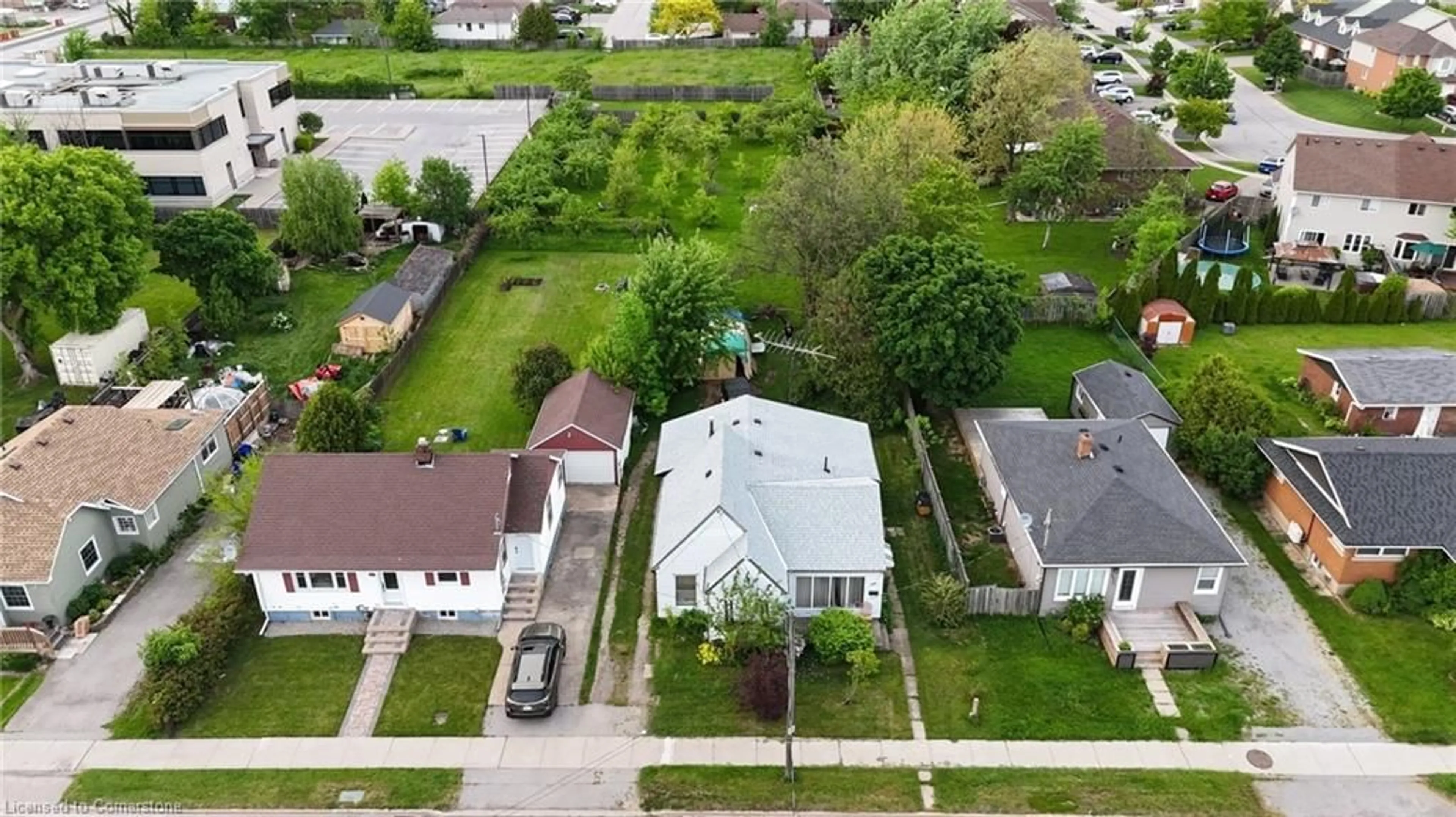 Frontside or backside of a home, the fenced backyard for 4977 John St, Beamsville Ontario L0R 1B6