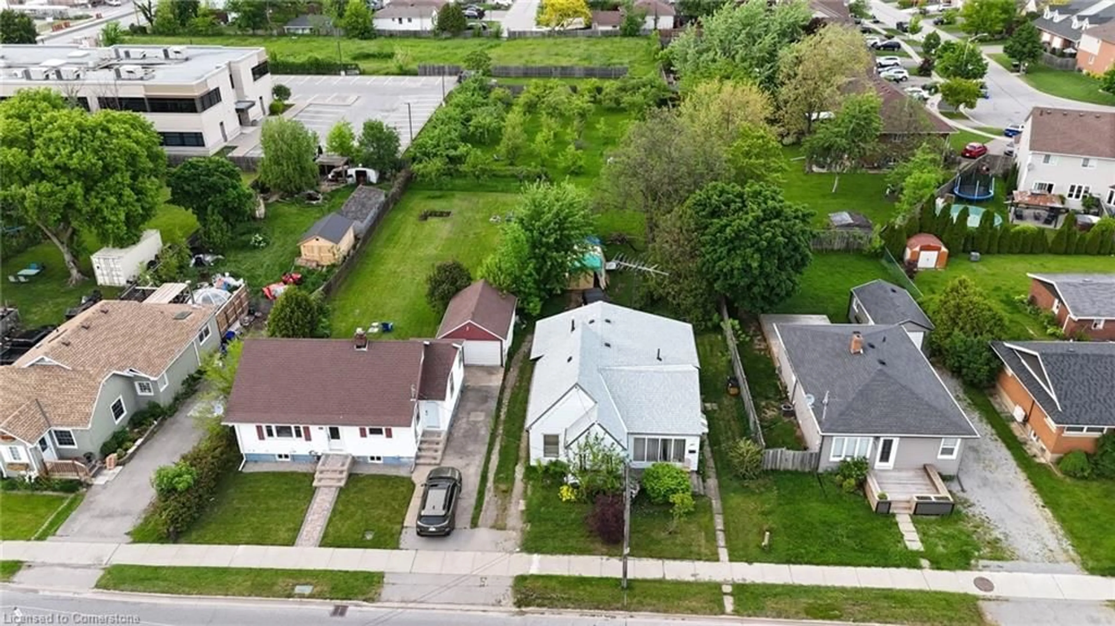 Frontside or backside of a home, the fenced backyard for 4977 John St, Beamsville Ontario L0R 1B6