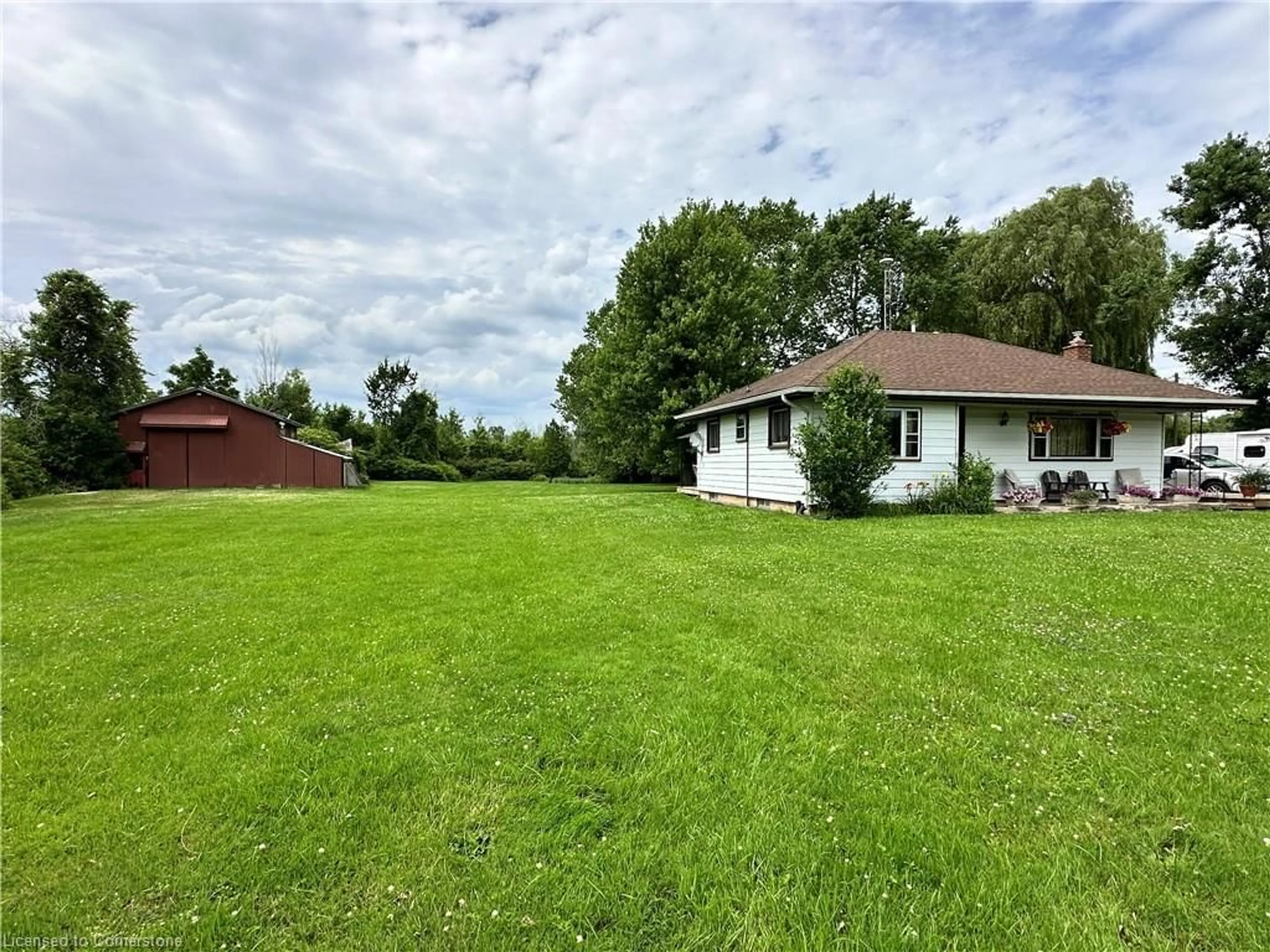 Frontside or backside of a home, the fenced backyard for 961 Canal Bank Rd, Dunnville Ontario N1A 2W5