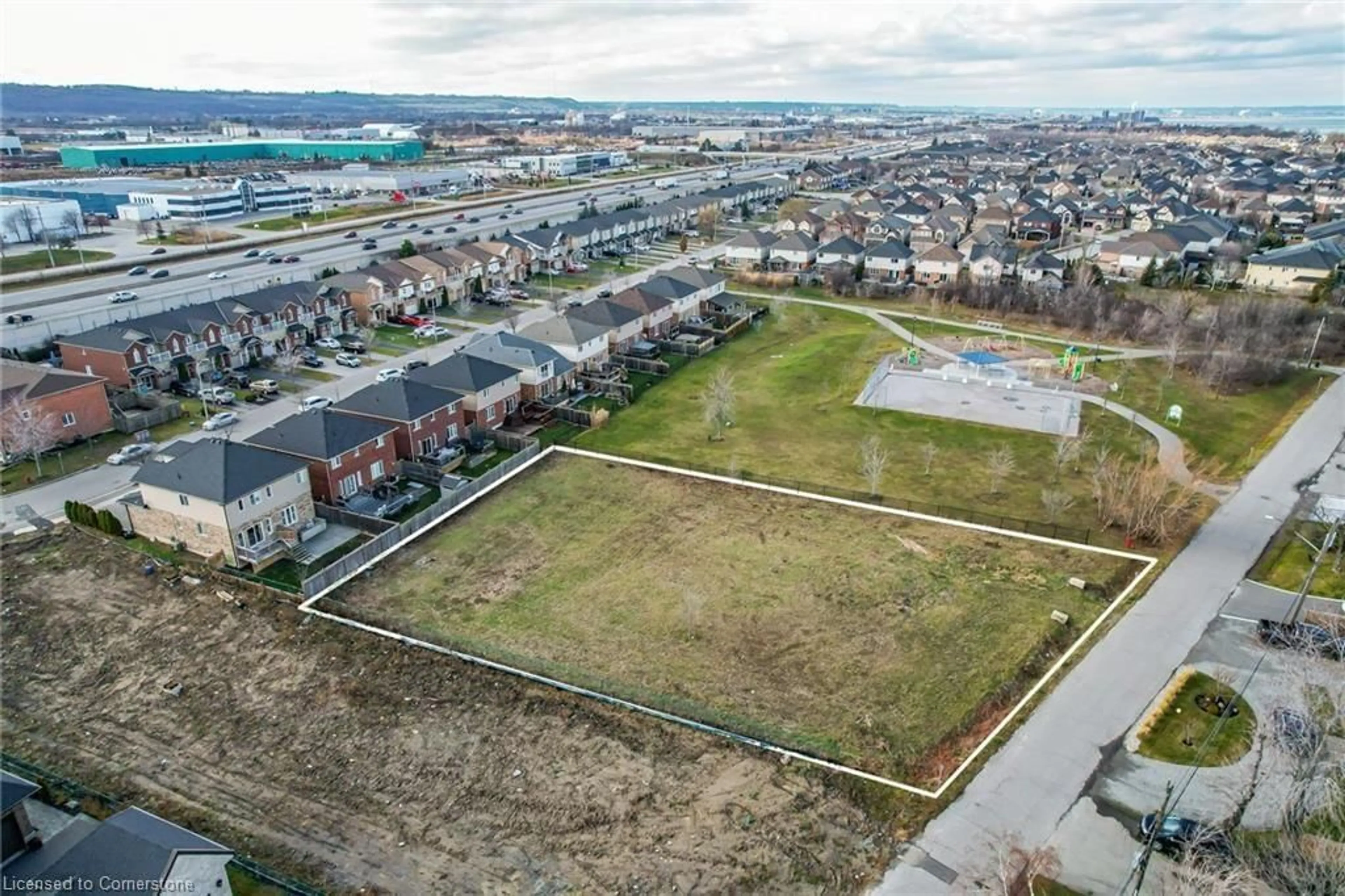 A pic from exterior of the house or condo, the fenced backyard for 67 Seabreeze Cres, Stoney Creek Ontario L8E 5C9