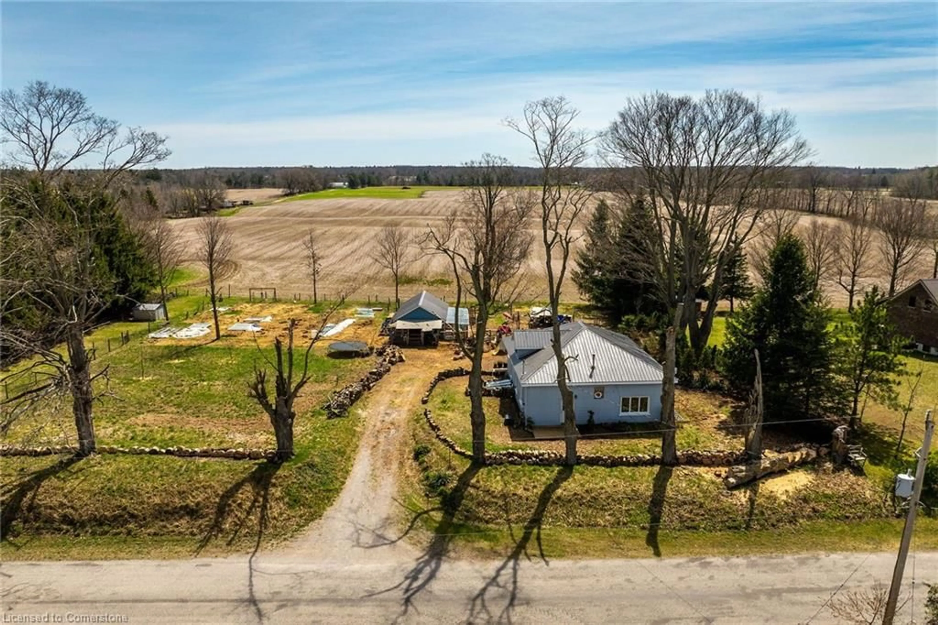 Frontside or backside of a home, the fenced backyard for 1686 10th Concession Rd, Langton Ontario N0E 1G0