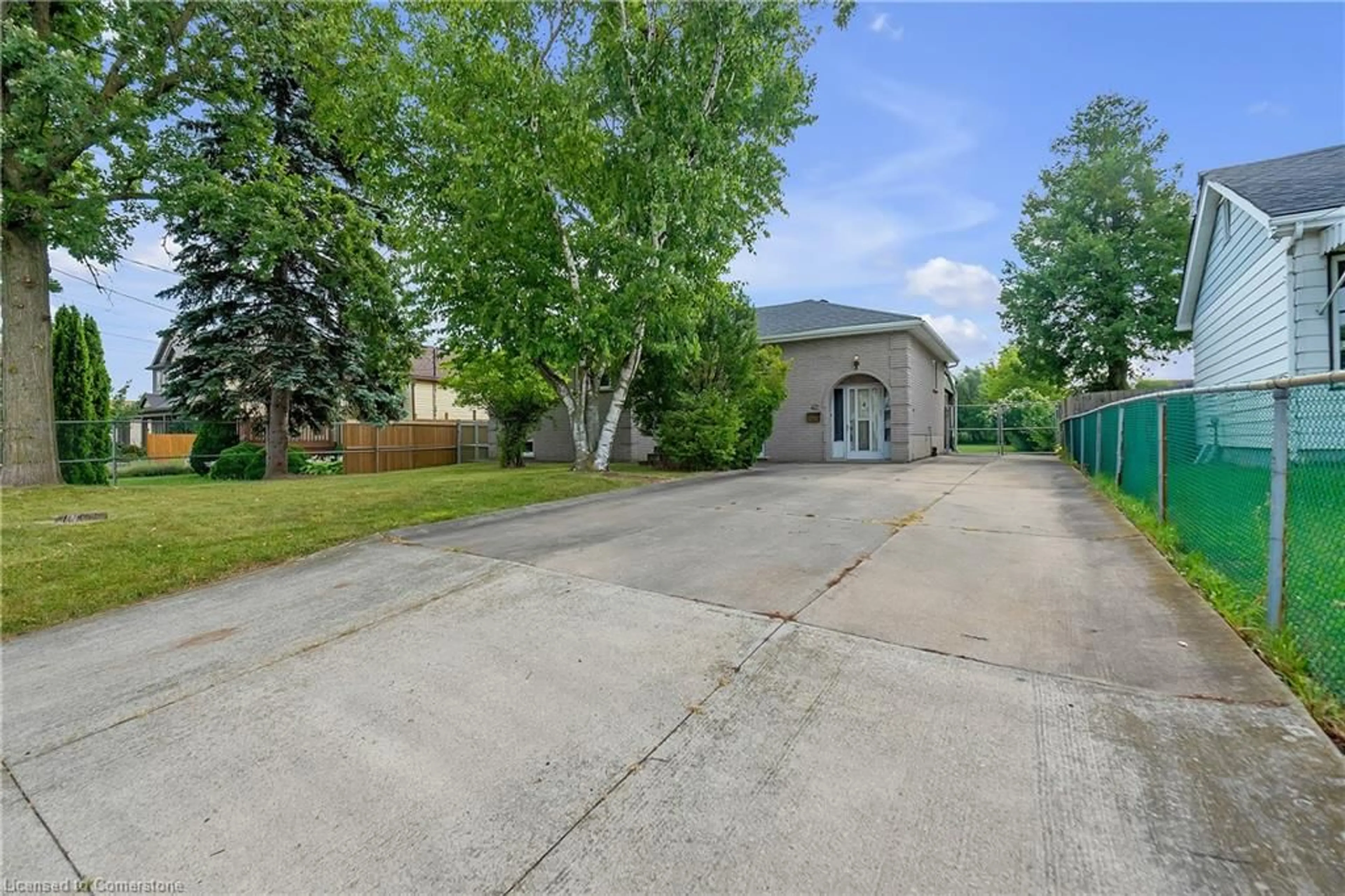 A pic from exterior of the house or condo, the fenced backyard for 42 Deerhurst Rd, Stoney Creek Ontario L8E 2E4