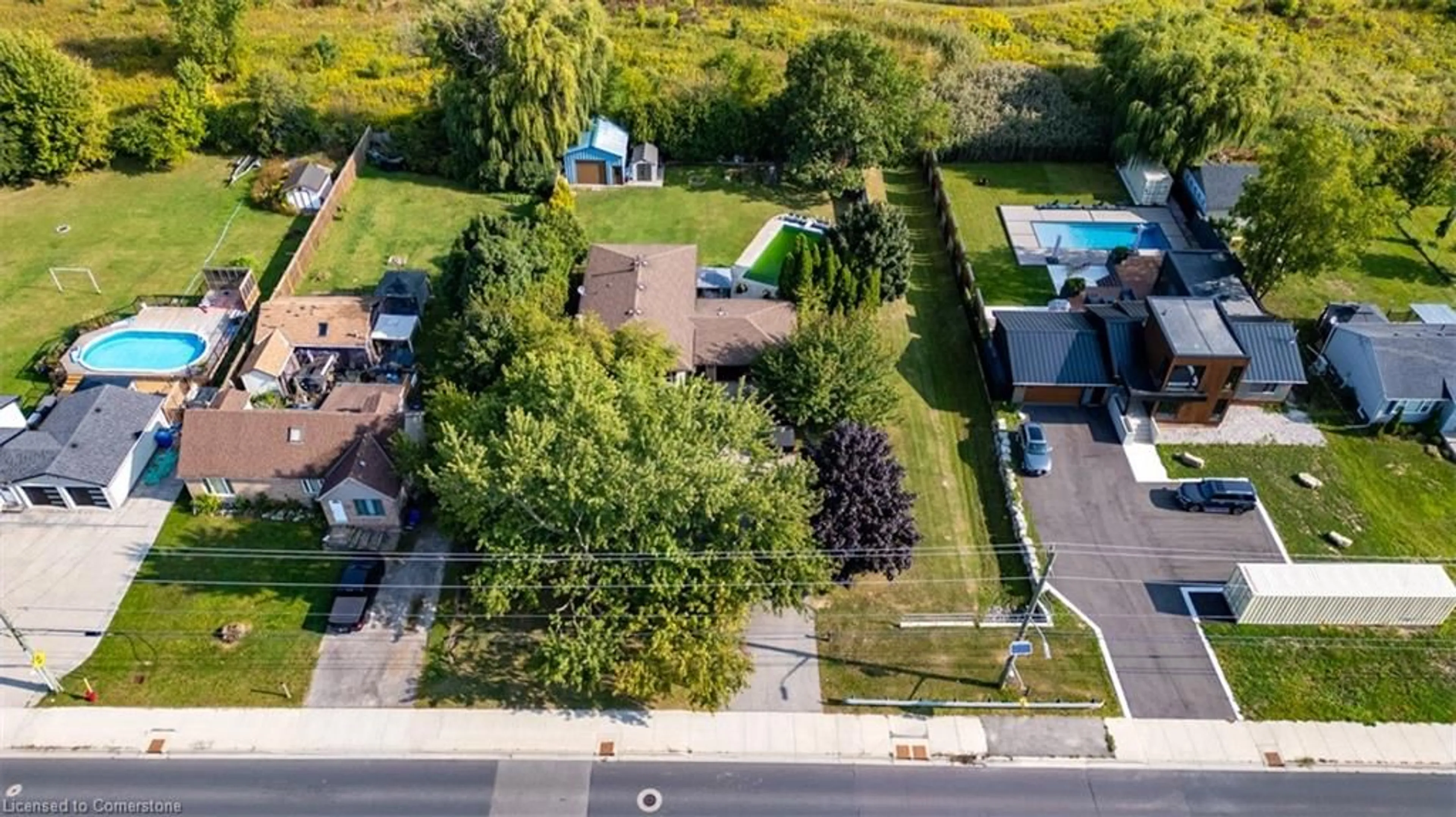 A pic from exterior of the house or condo, the fenced backyard for 1889 Rymal Rd, Hamilton Ontario K6H 5R5