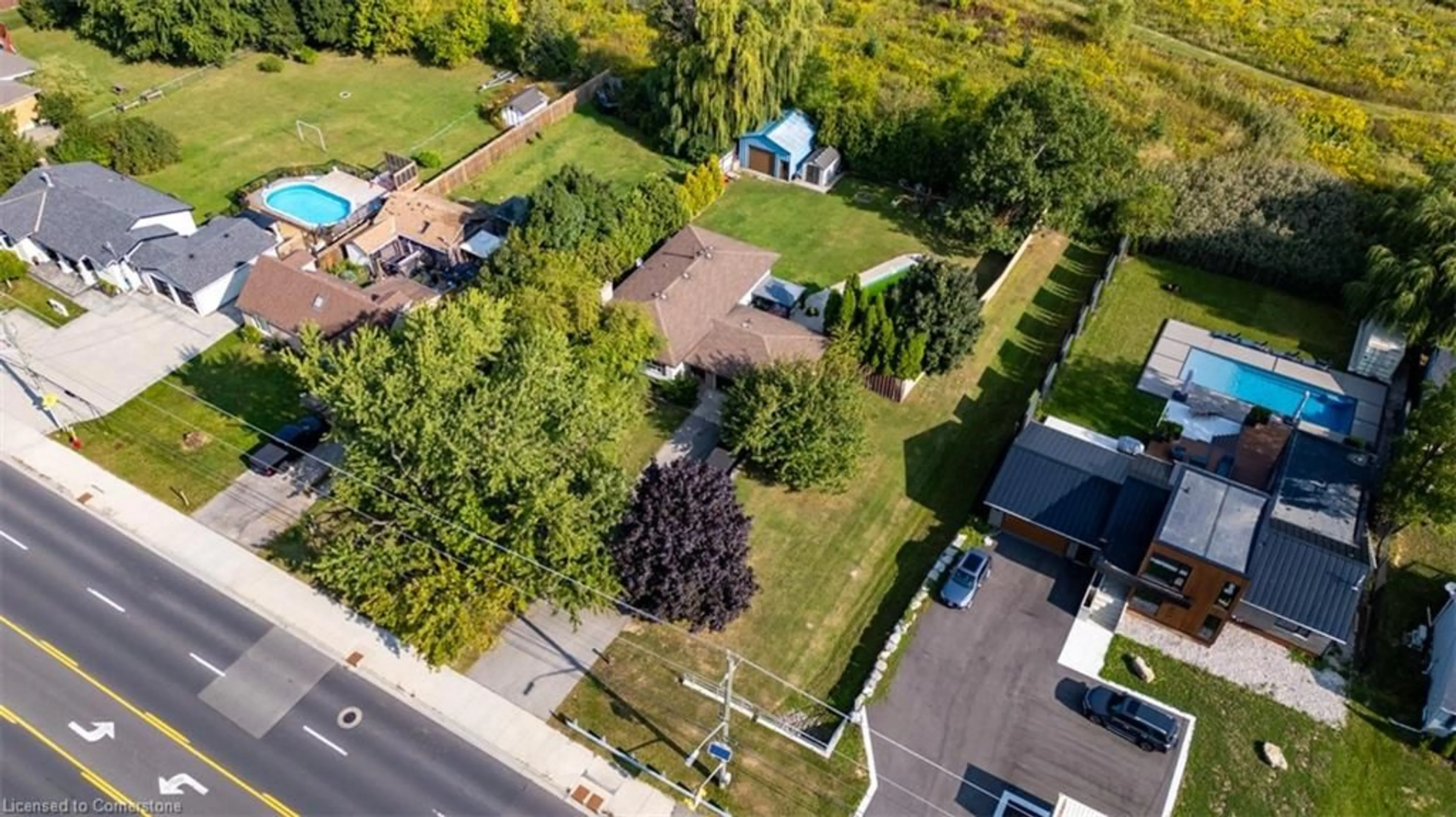 A pic from exterior of the house or condo, the fenced backyard for 1889 Rymal Rd, Hamilton Ontario K6H 5R5