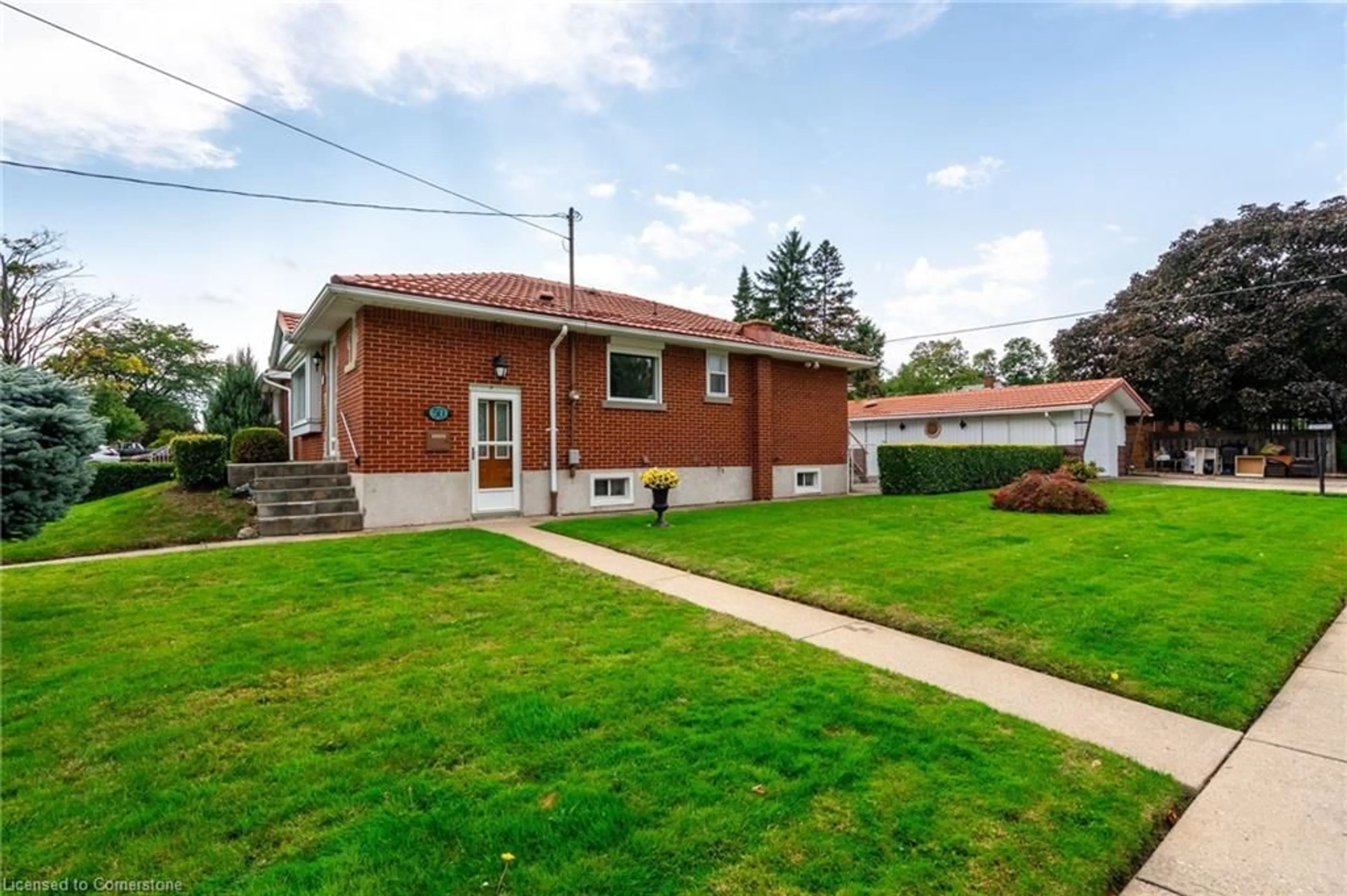 Frontside or backside of a home, the fenced backyard for 50 Fernwood Cres, Hamilton Ontario L8T 3L1