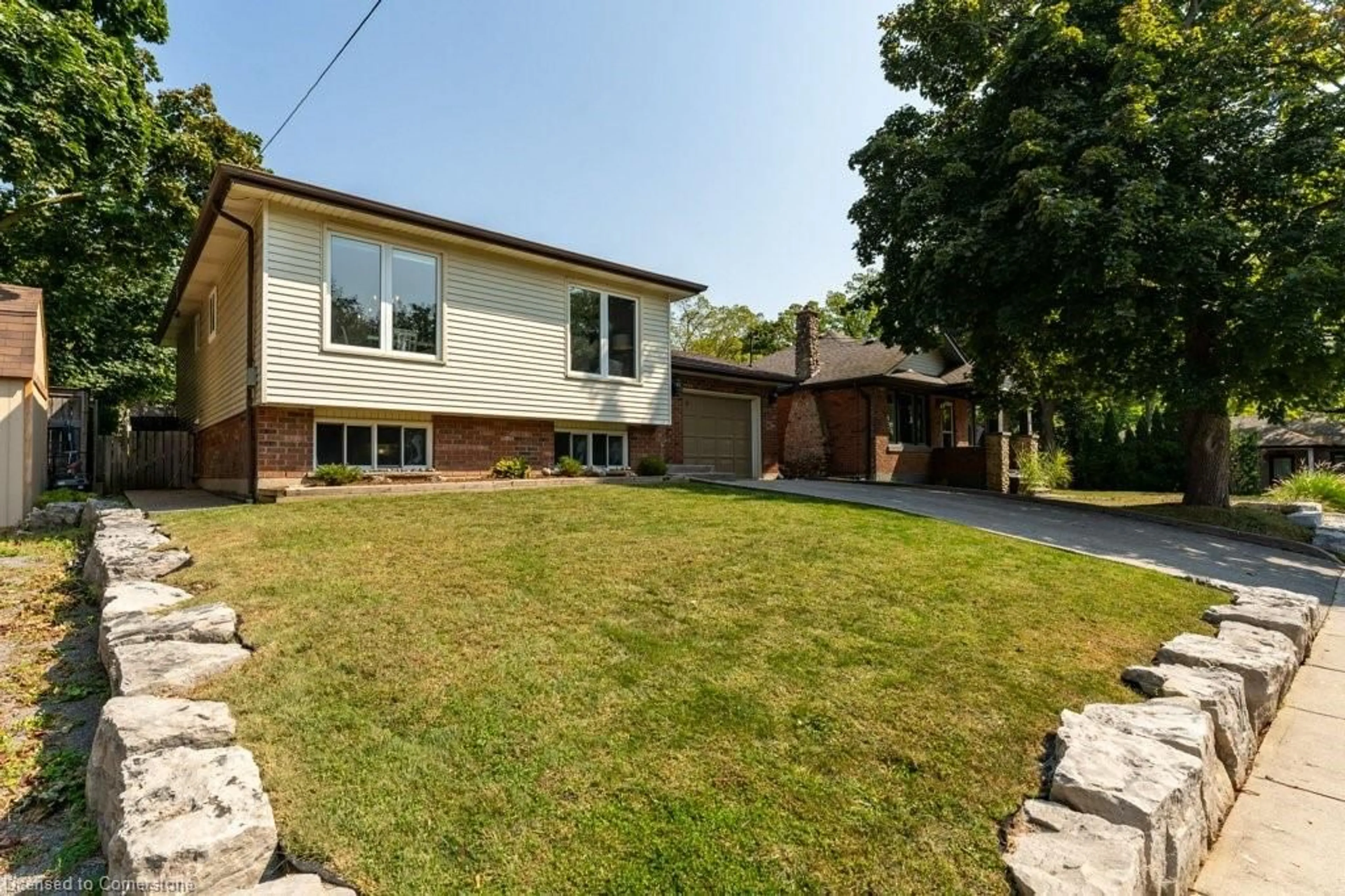 Frontside or backside of a home, the fenced backyard for 17 George St, Waterdown Ontario L0R 2H0