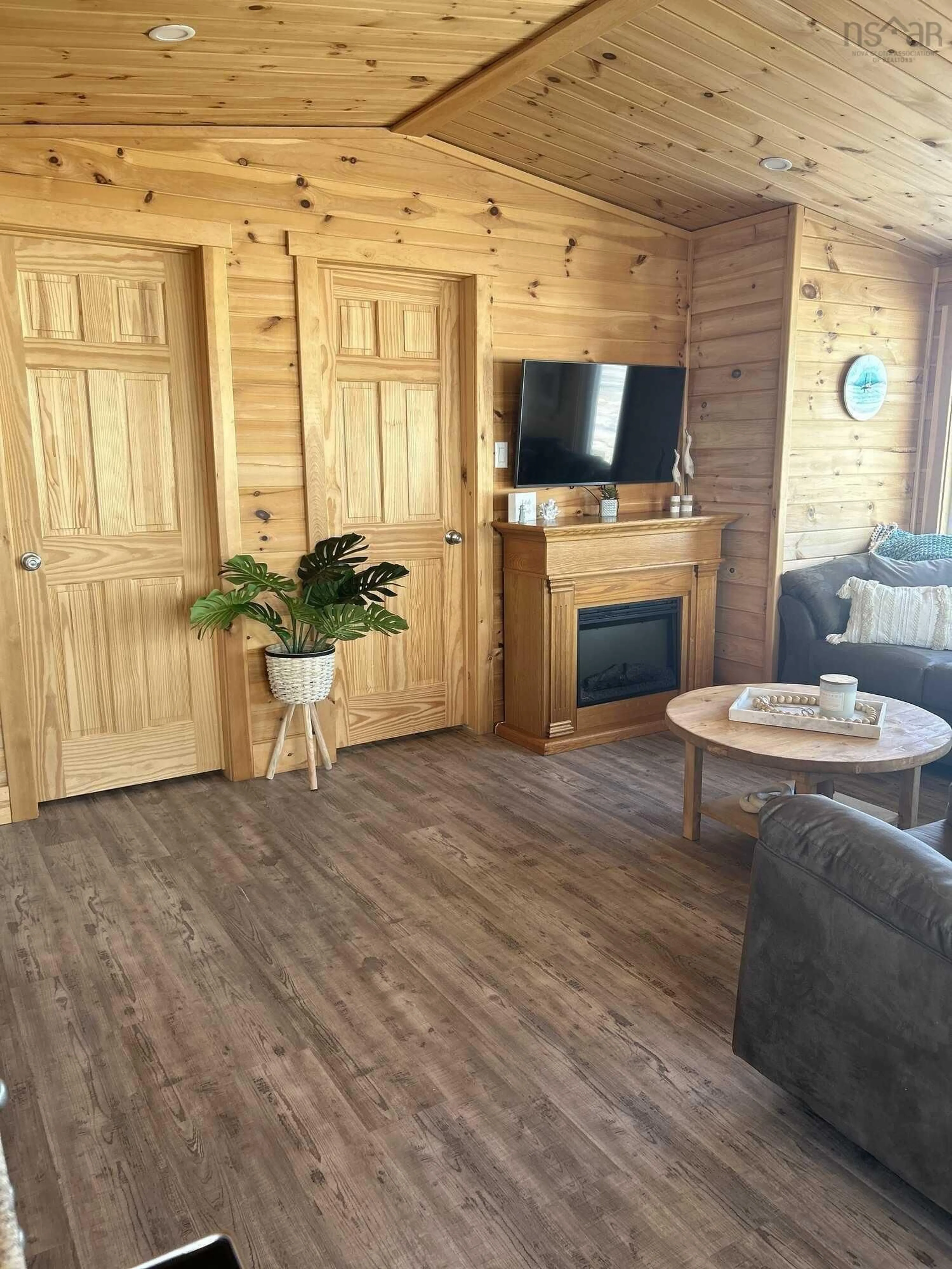 Living room with furniture, wood/laminate floor for 565 Caribou Island Rd, Caribou Island Nova Scotia B0K 1H0