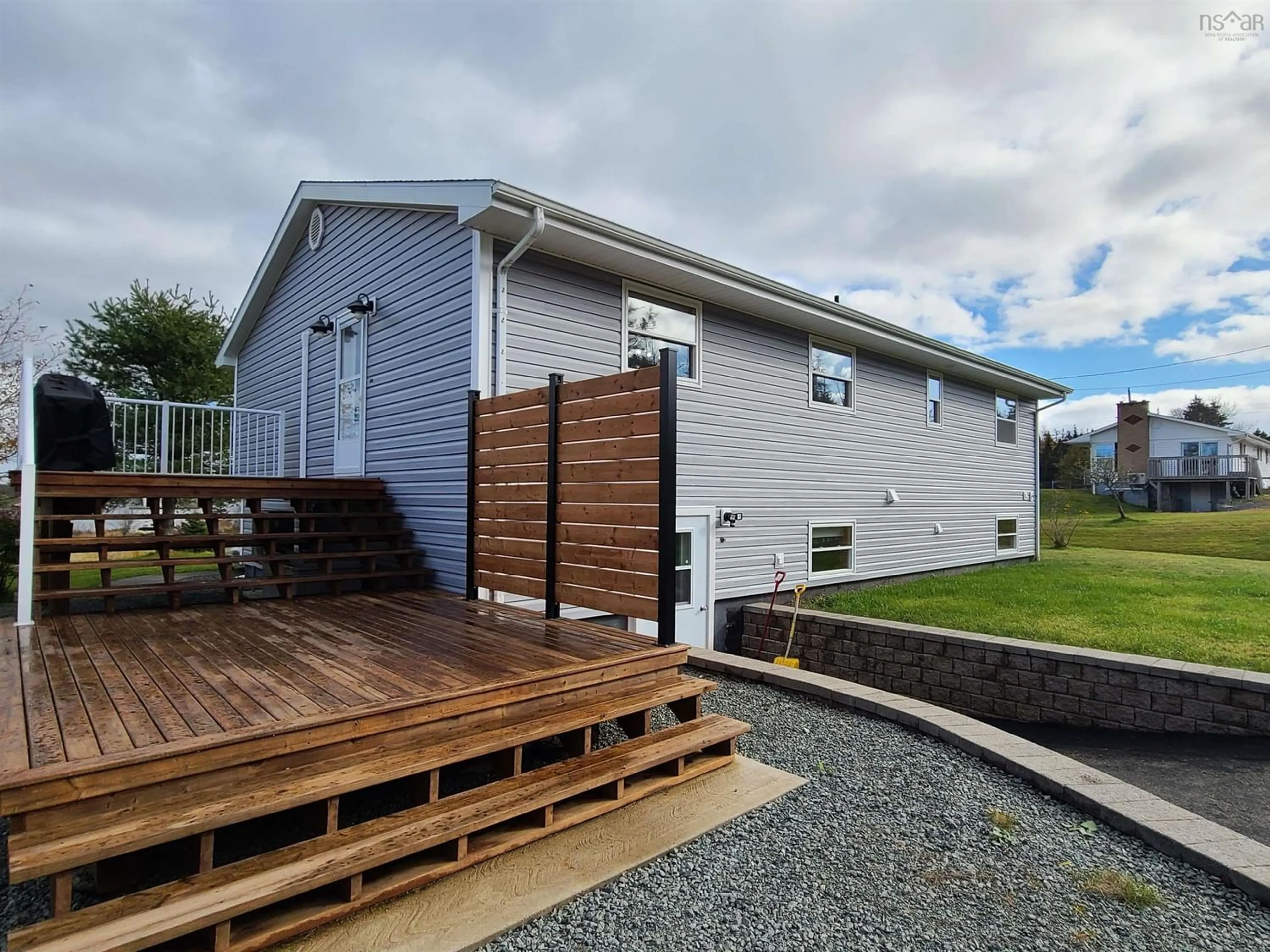 Frontside or backside of a home, the fenced backyard for 110 De Raymond St, St. Peter's Nova Scotia B0E 3B0