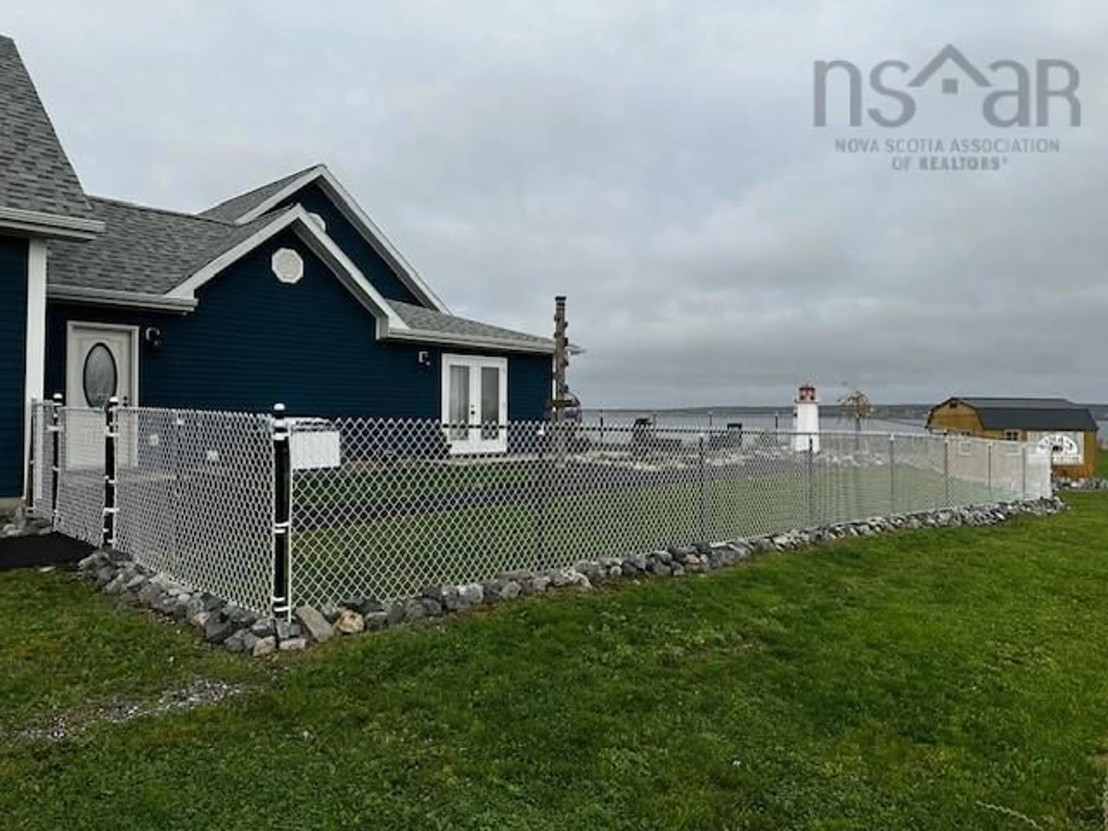 Fenced yard for 931 Shore Rd, Sydney Mines Nova Scotia B1V 1B1