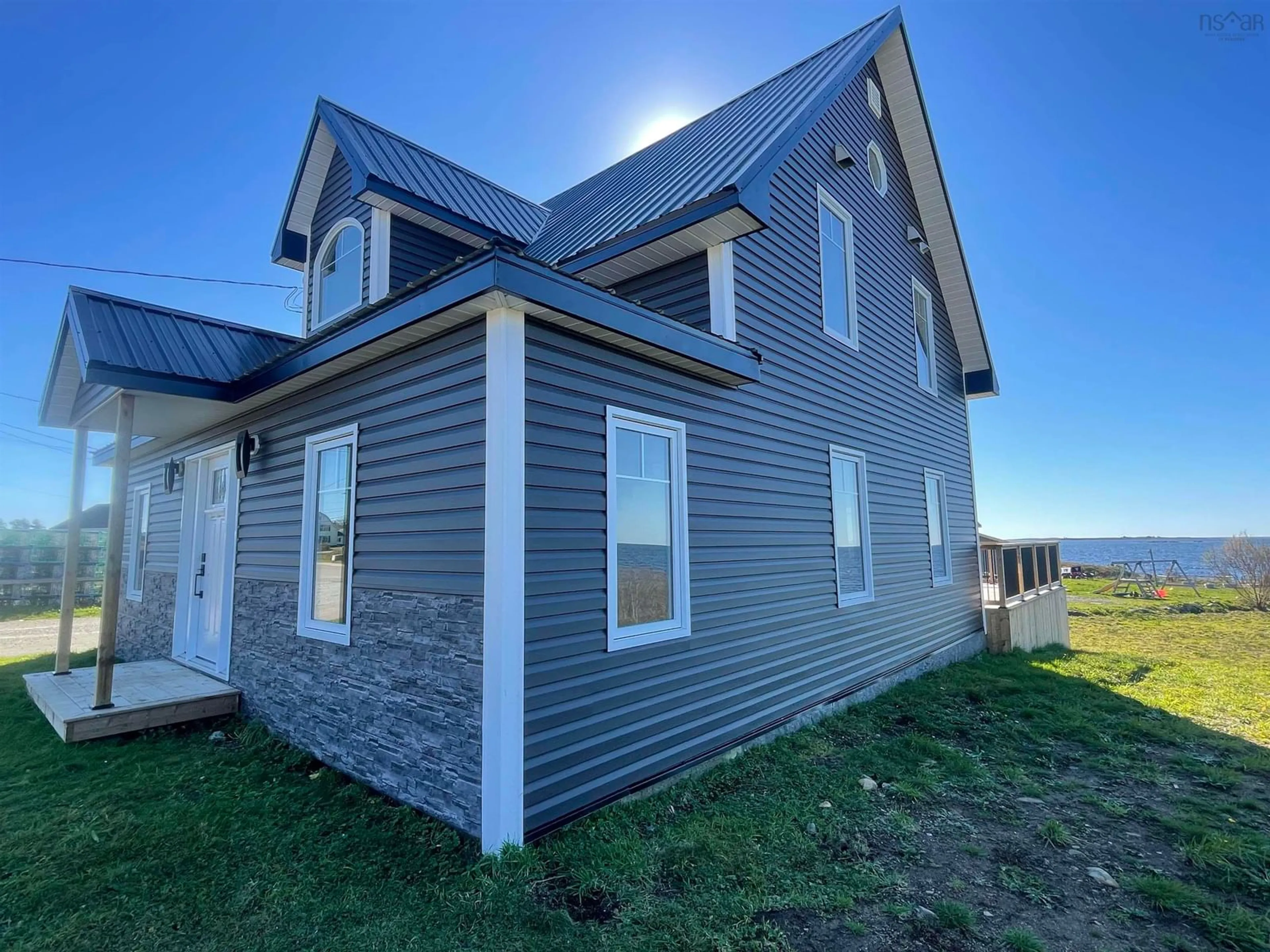 Home with vinyl exterior material for 2844 Main St, Clark's Harbour Nova Scotia B0W 1P0