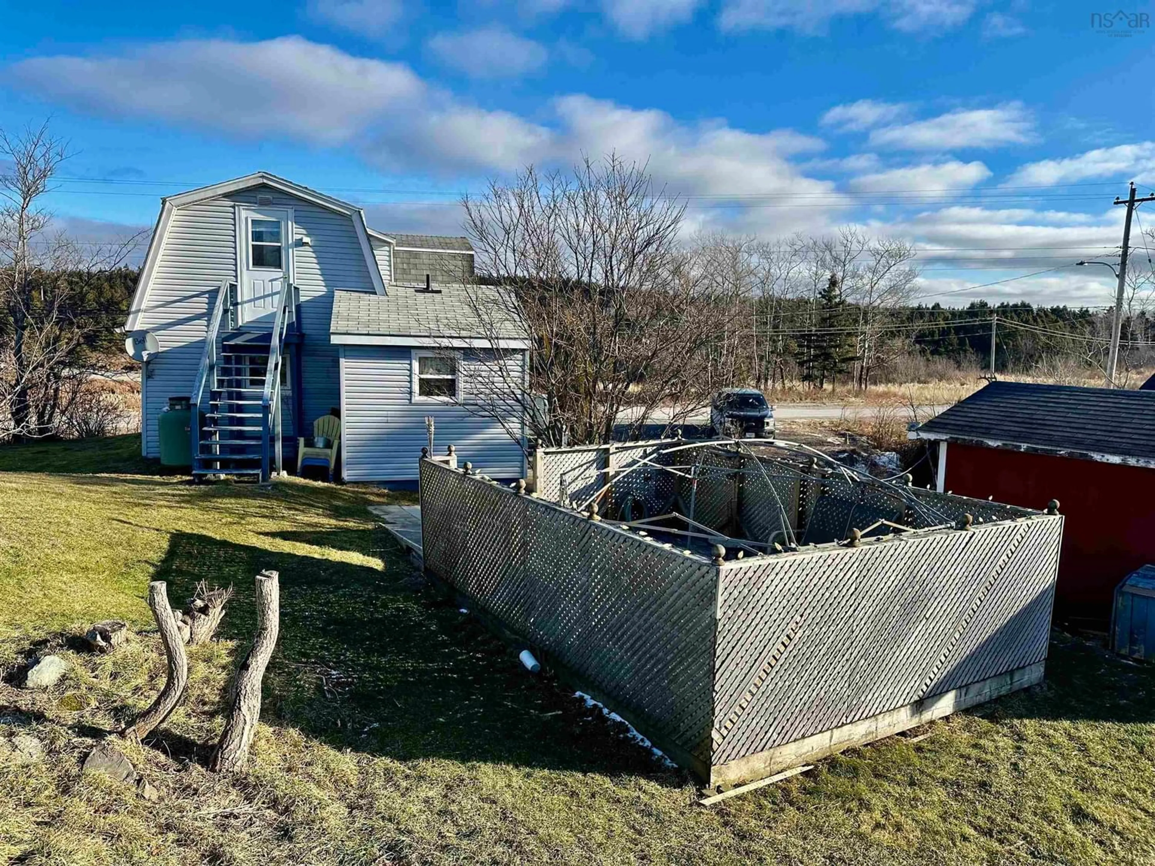 Frontside or backside of a home, the fenced backyard for 2028 Hwy 247, L'Ardoise Nova Scotia B0E 1S0