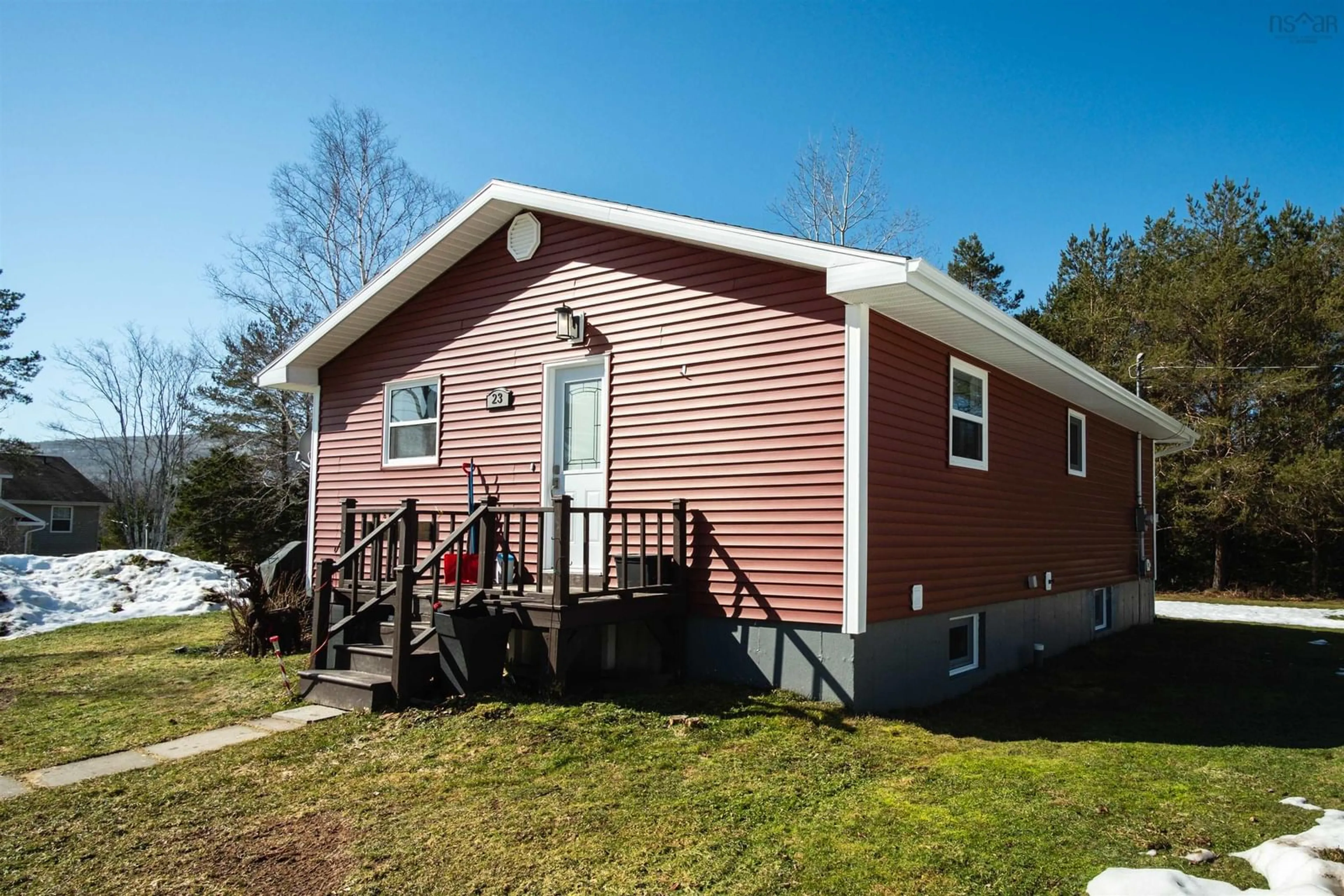 Home with vinyl exterior material for 23 Johnson Lane, Whycocomagh Nova Scotia B0E 3M0