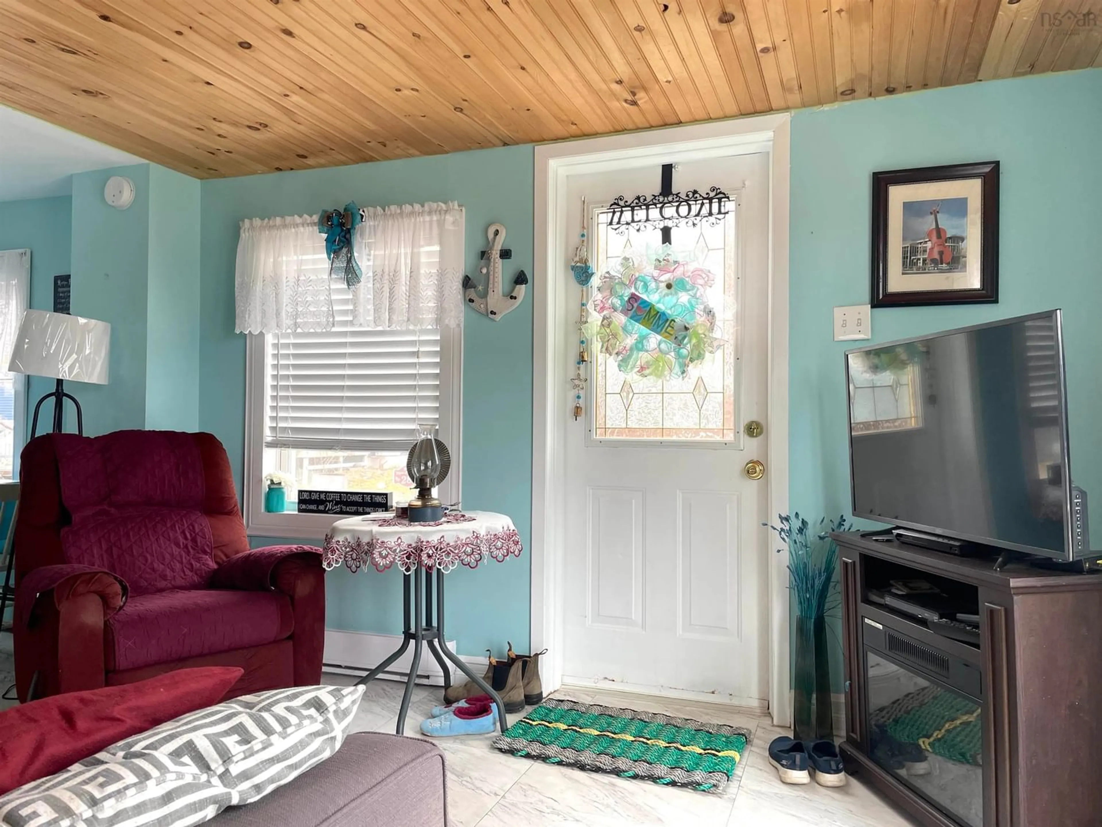 Living room, wood floors for 27 Chemin Shomphe Rd, Chéticamp Nova Scotia B0E 1H0