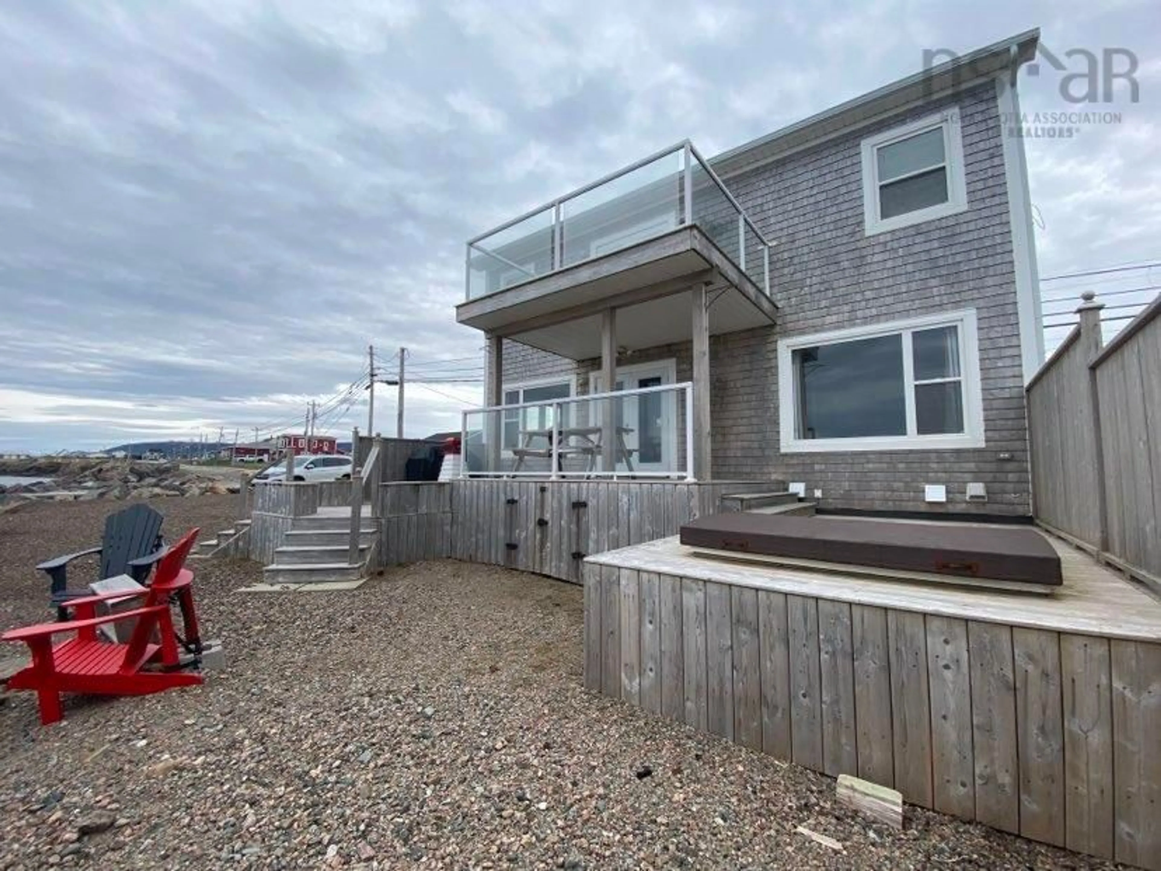 A pic from exterior of the house or condo, the fenced backyard for 15495 Cabot Trail, Chéticamp Nova Scotia B0E 1H0