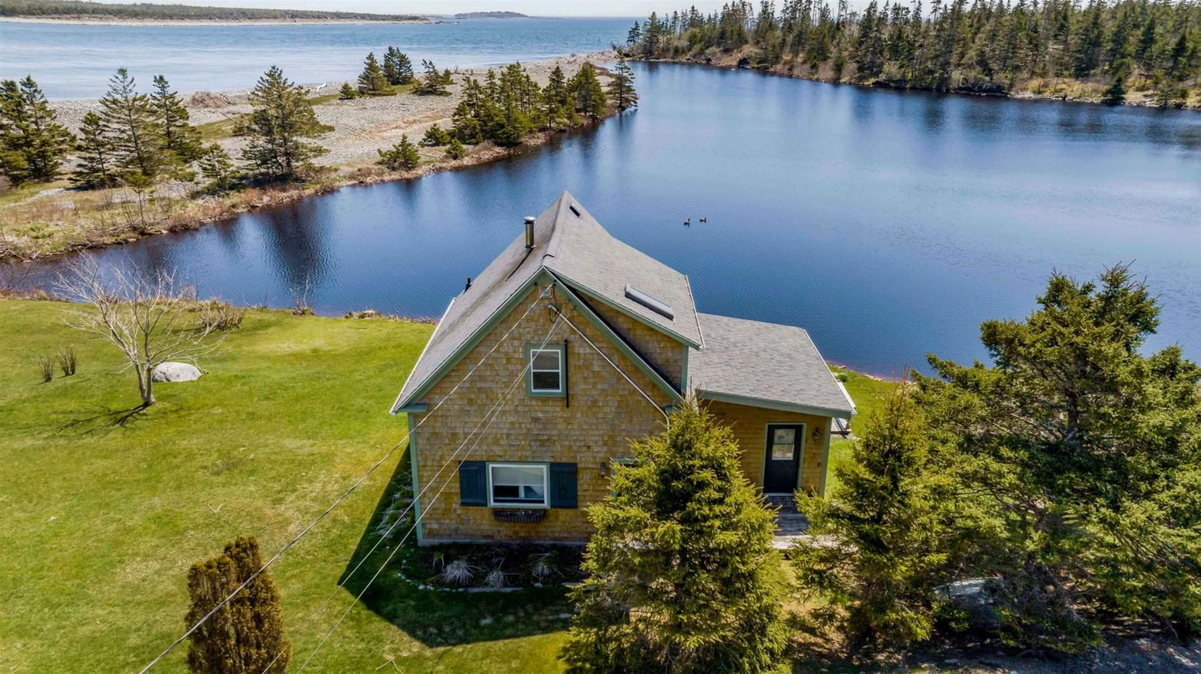 A pic from outside/outdoor area/front of a property/back of a property/a pic from drone, water/lake/river/ocean view for 2229 West Jeddore Rd, West Jeddore Nova Scotia B0J 1P0