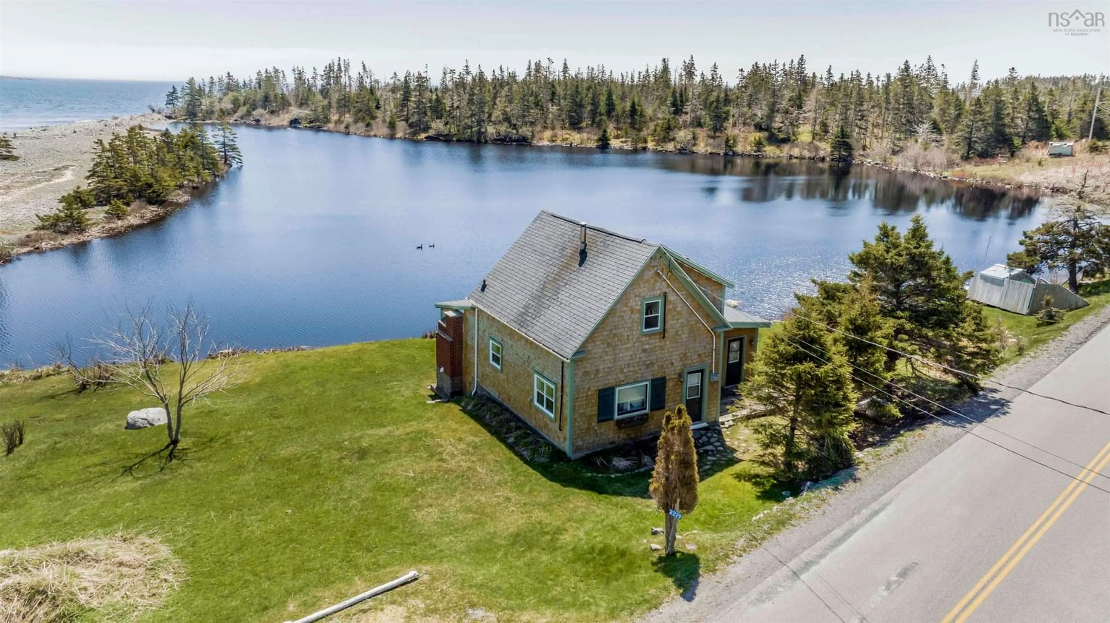 A pic from outside/outdoor area/front of a property/back of a property/a pic from drone, water/lake/river/ocean view for 2229 West Jeddore Rd, West Jeddore Nova Scotia B0J 1P0