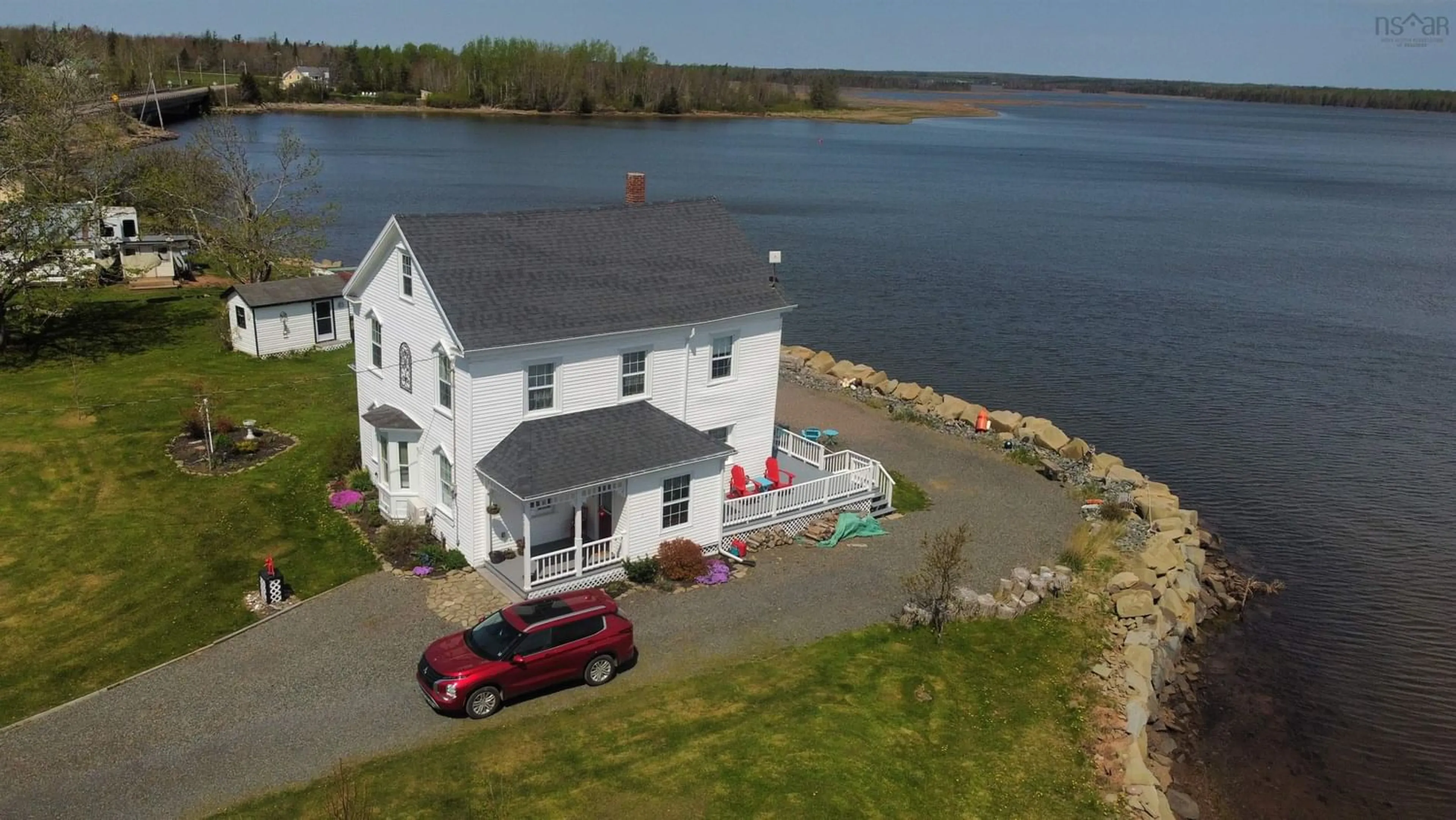 A pic from outside/outdoor area/front of a property/back of a property/a pic from drone, water/lake/river/ocean view for 13291 Highway 6, Wallace Bridge Nova Scotia B0K 1Y0