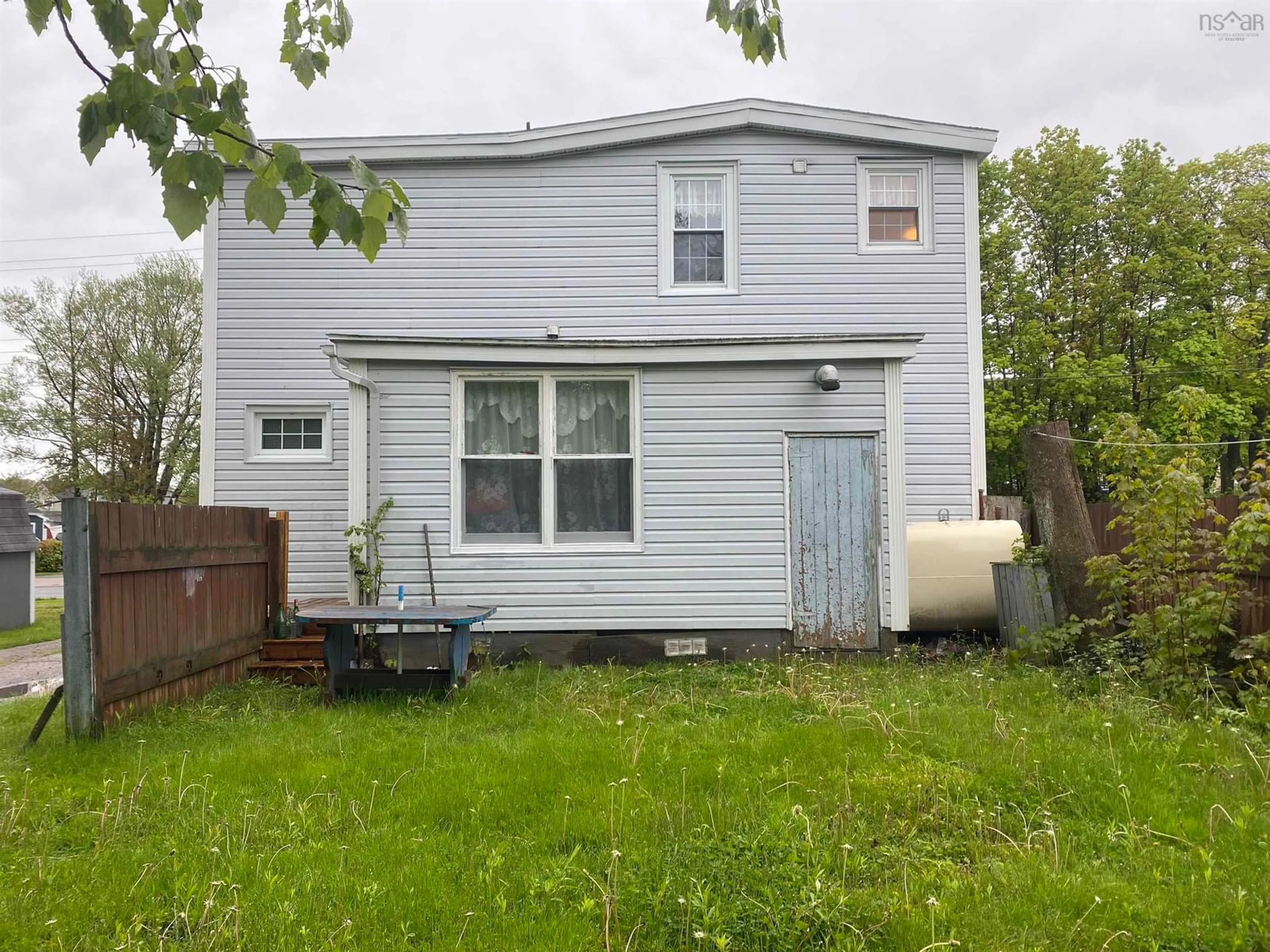 Frontside or backside of a home, the fenced backyard for 69 Stanley Street, North Sydney Nova Scotia B2A 1V1