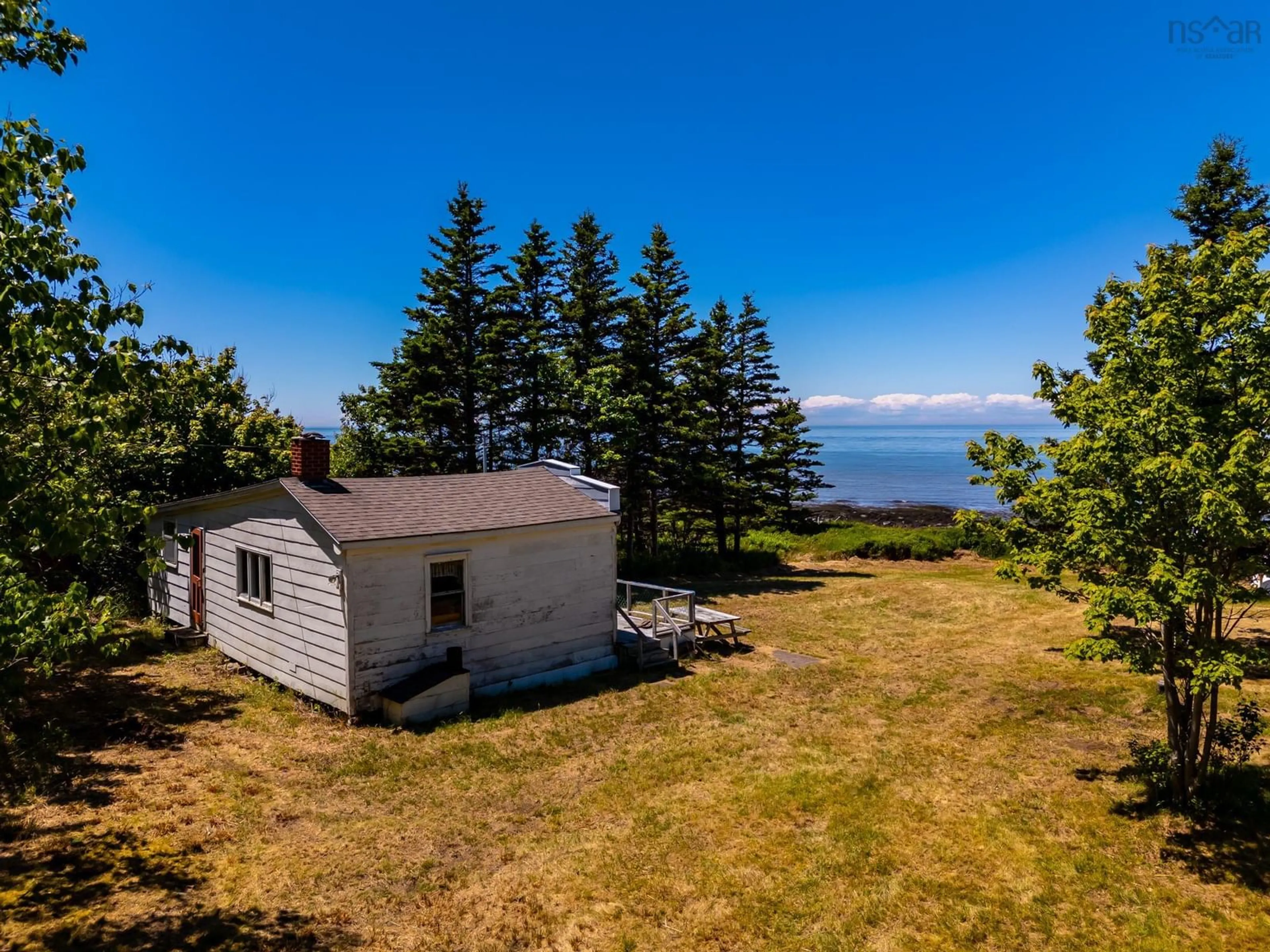 A pic from outside/outdoor area/front of a property/back of a property/a pic from drone, water/lake/river/ocean view for 6847 Shore Rd, Phinneys Cove Nova Scotia B0S 1C0