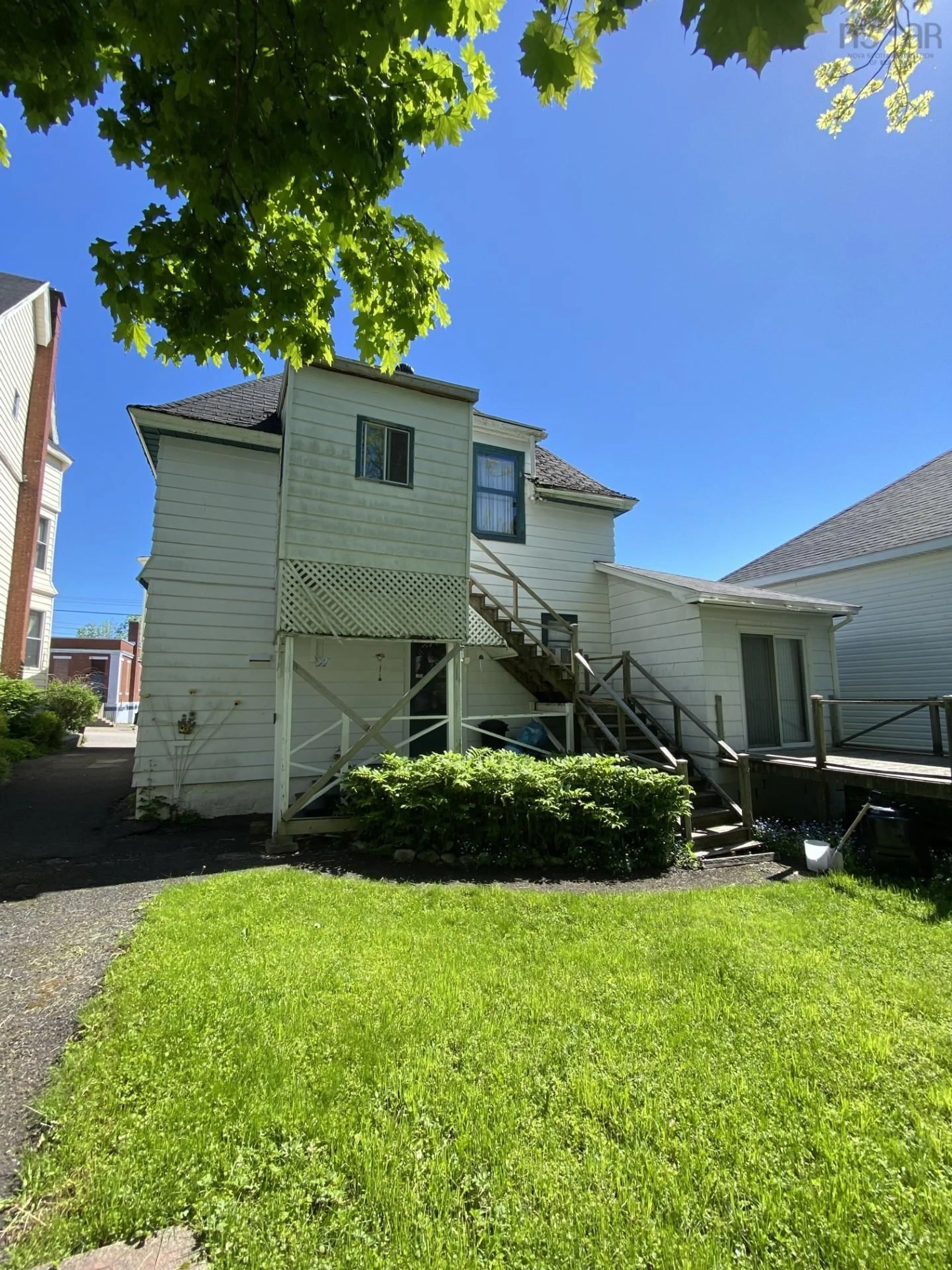 A pic from exterior of the house or condo, the fenced backyard for 24 Archibald Ave, North Sydney Nova Scotia B2A 2W3