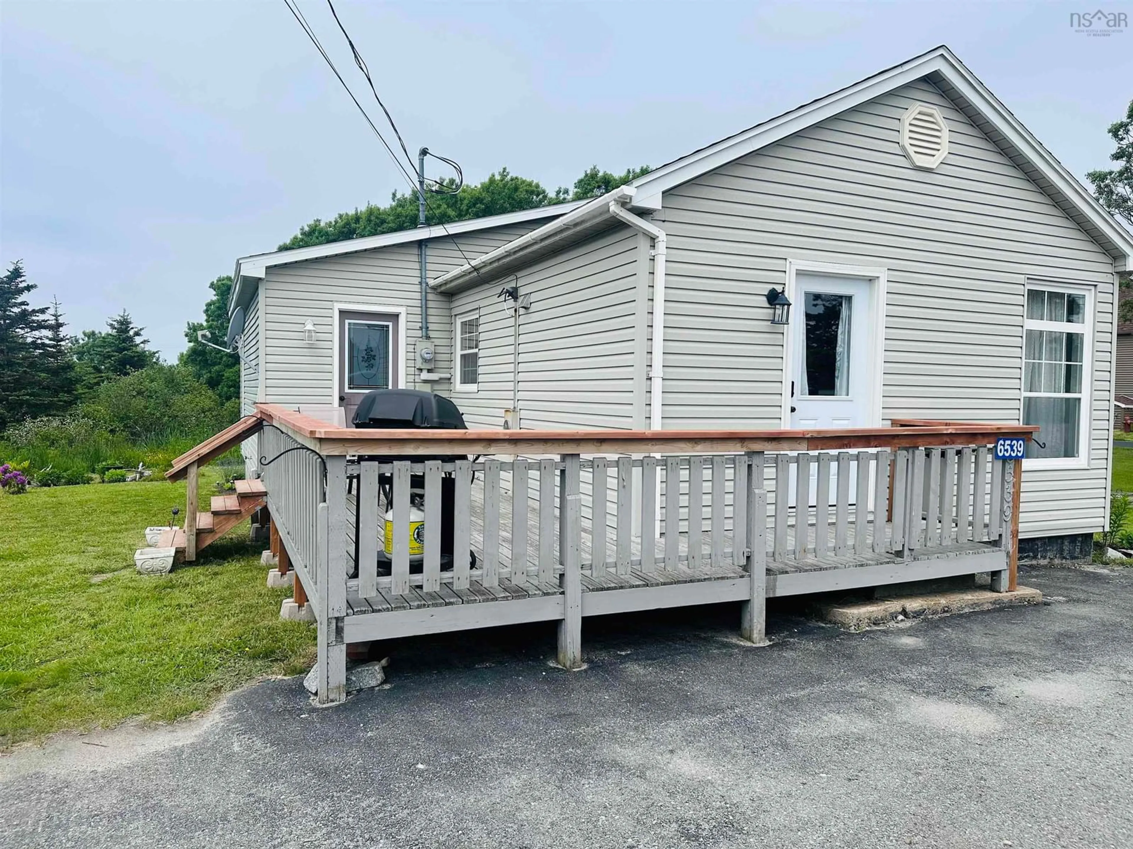 Frontside or backside of a home for 6539 Highway 3, Lower Woods Harbour Nova Scotia B0W 2E0