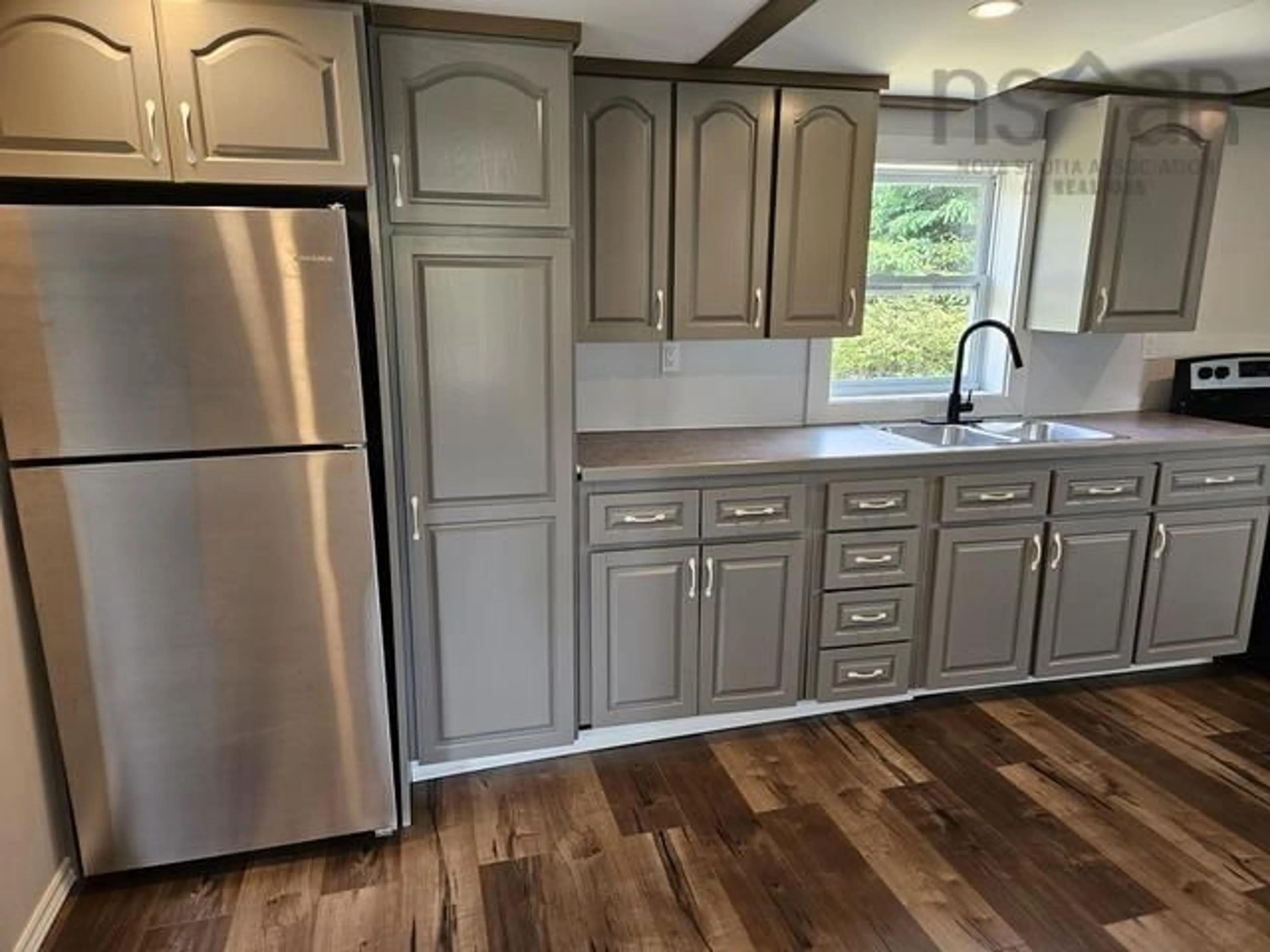 Open concept kitchen, wood/laminate floor for 67 Bear Point Rd, Bear Point Nova Scotia B0W 3B0