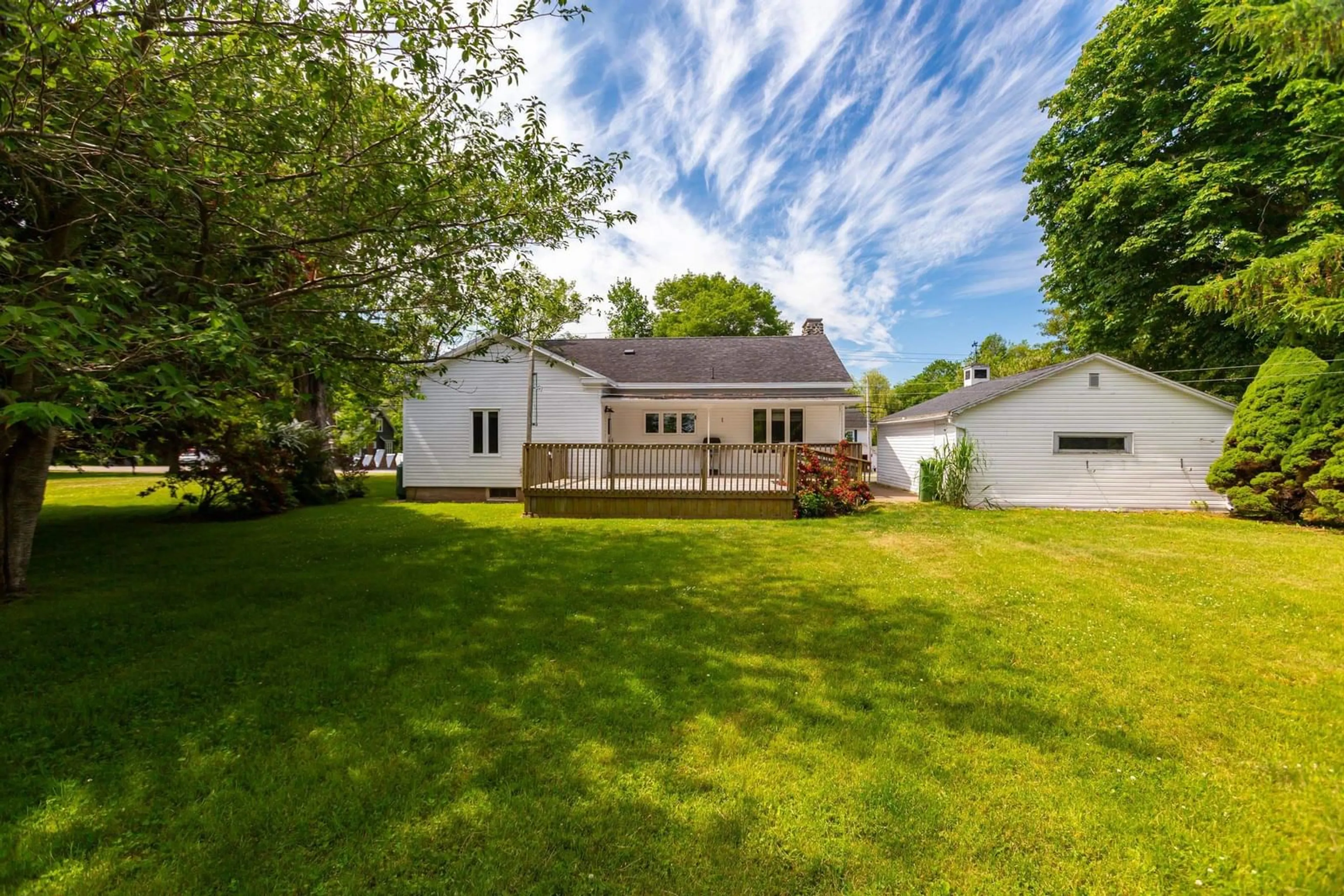 Frontside or backside of a home, the fenced backyard for 726 St George St, Annapolis Royal Nova Scotia B0S 1A0