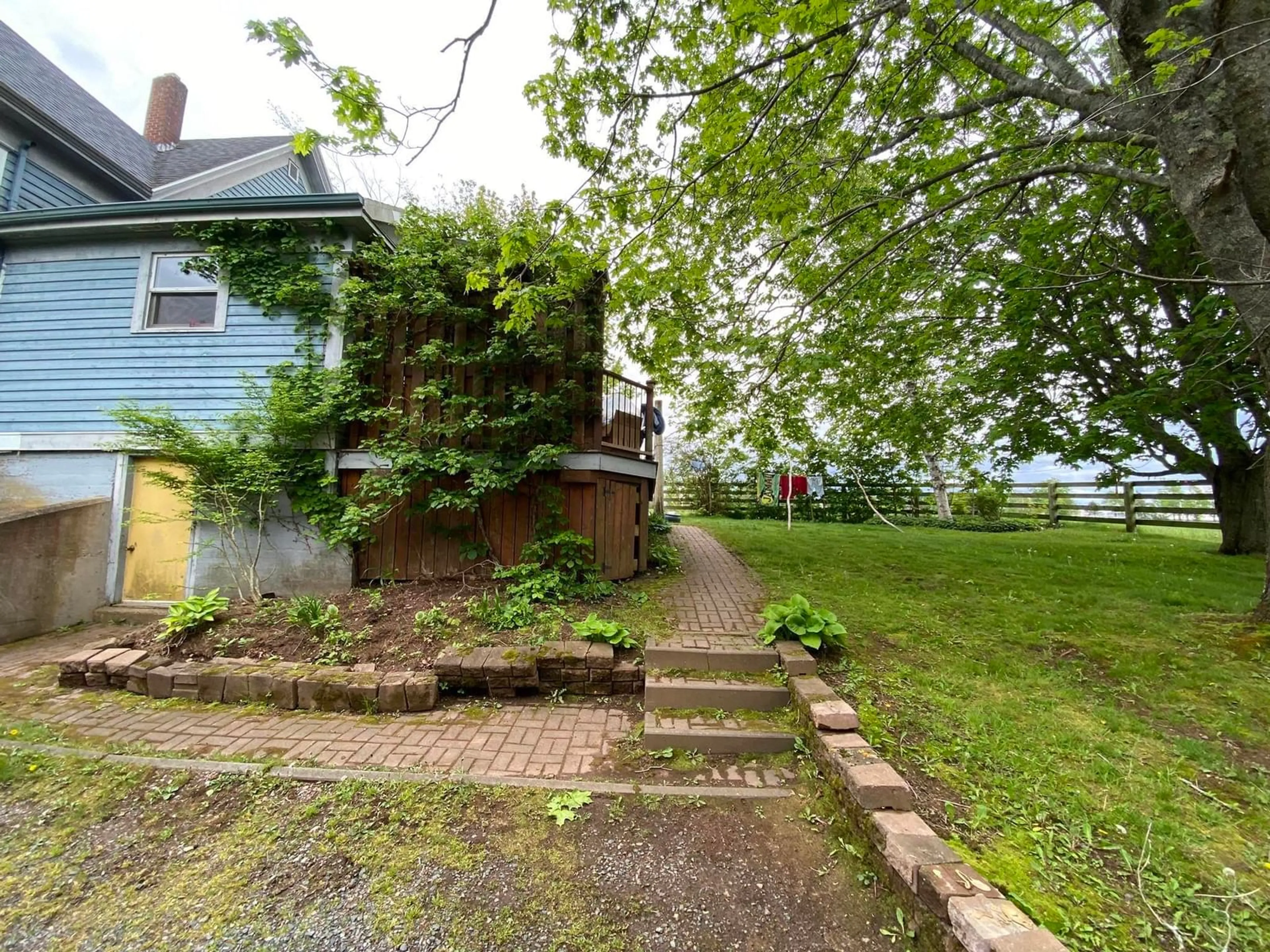 Frontside or backside of a home, the fenced backyard for 8920 Highway 2, Great Village Nova Scotia B0M 1L0