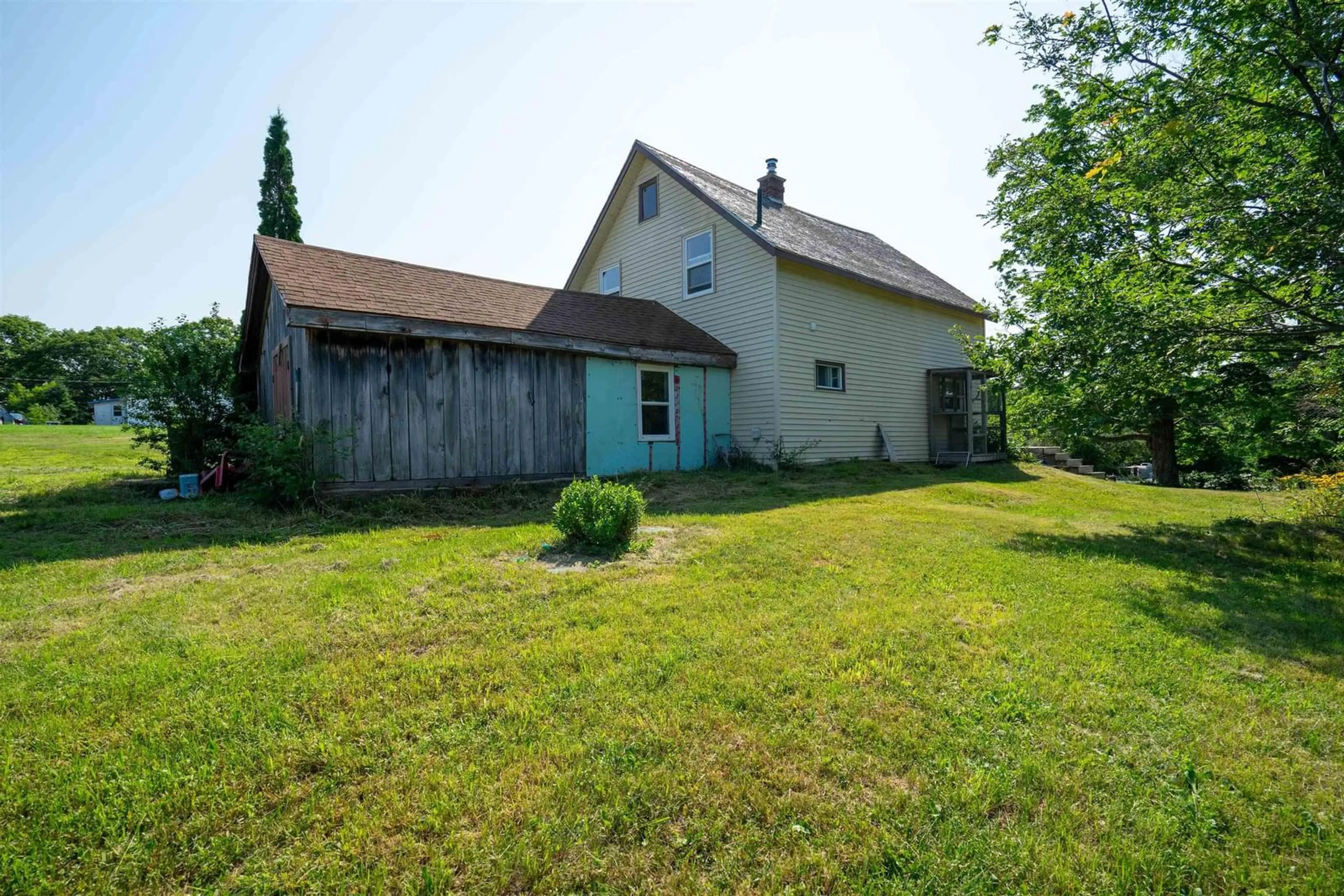 Frontside or backside of a home, the fenced backyard for 2463 Clementsvale Rd, Bear River East Nova Scotia B0S 1B0