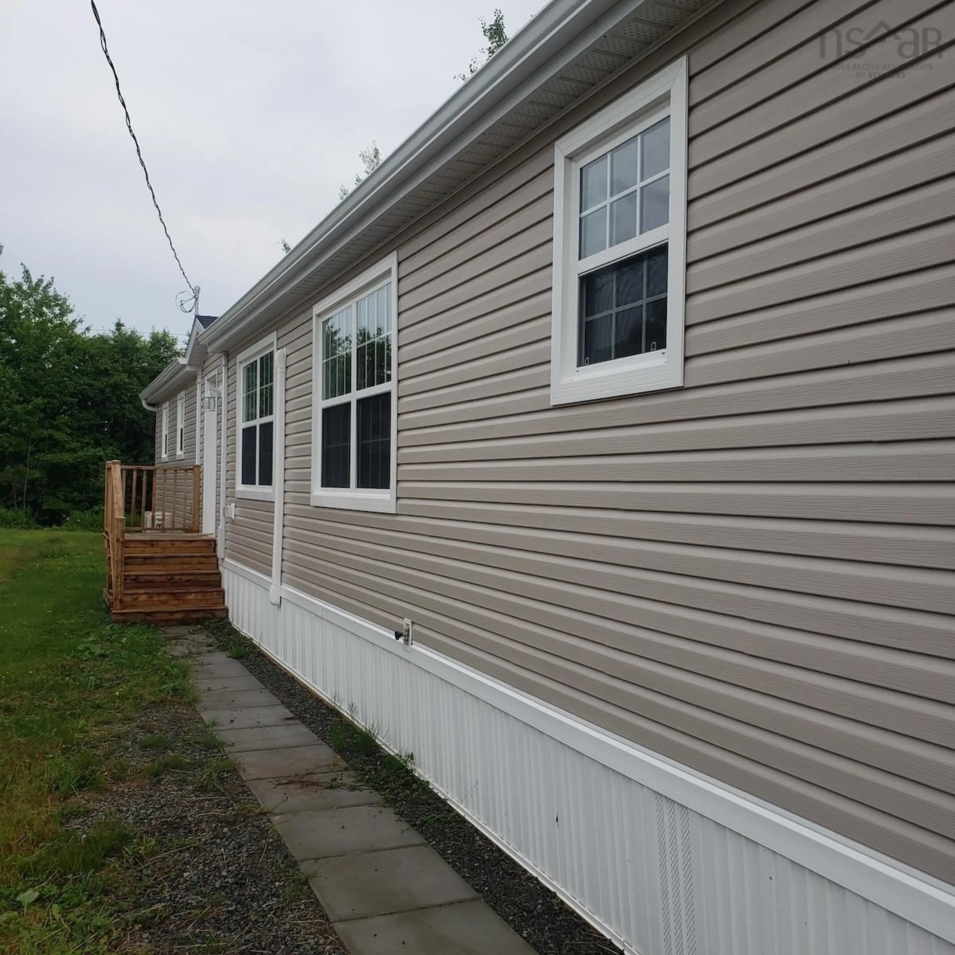 Home with vinyl exterior material for 2 Trainor Dr, Port Hawkesbury Nova Scotia B9N 3N8