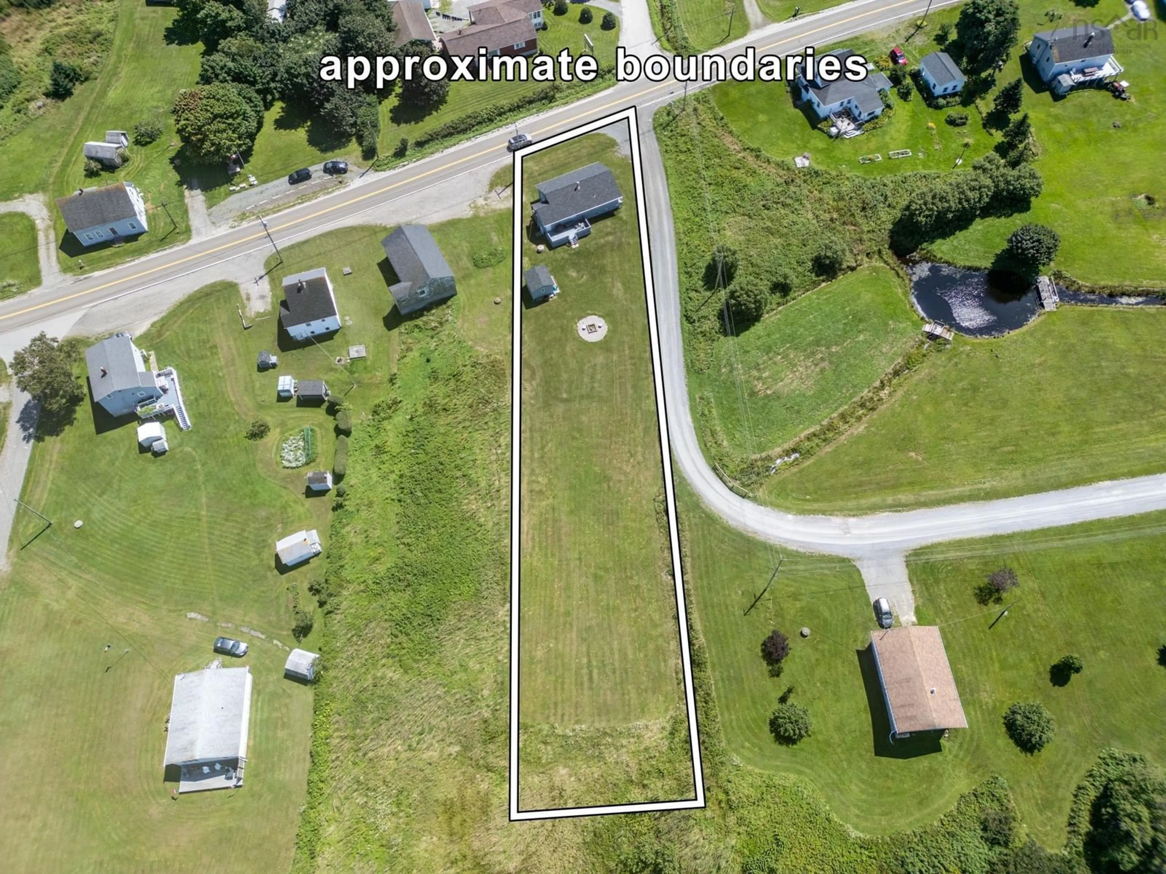 A pic from outside/outdoor area/front of a property/back of a property/a pic from drone, street for 2523 Highway 1, Grosses Coques Nova Scotia B0W 1M0