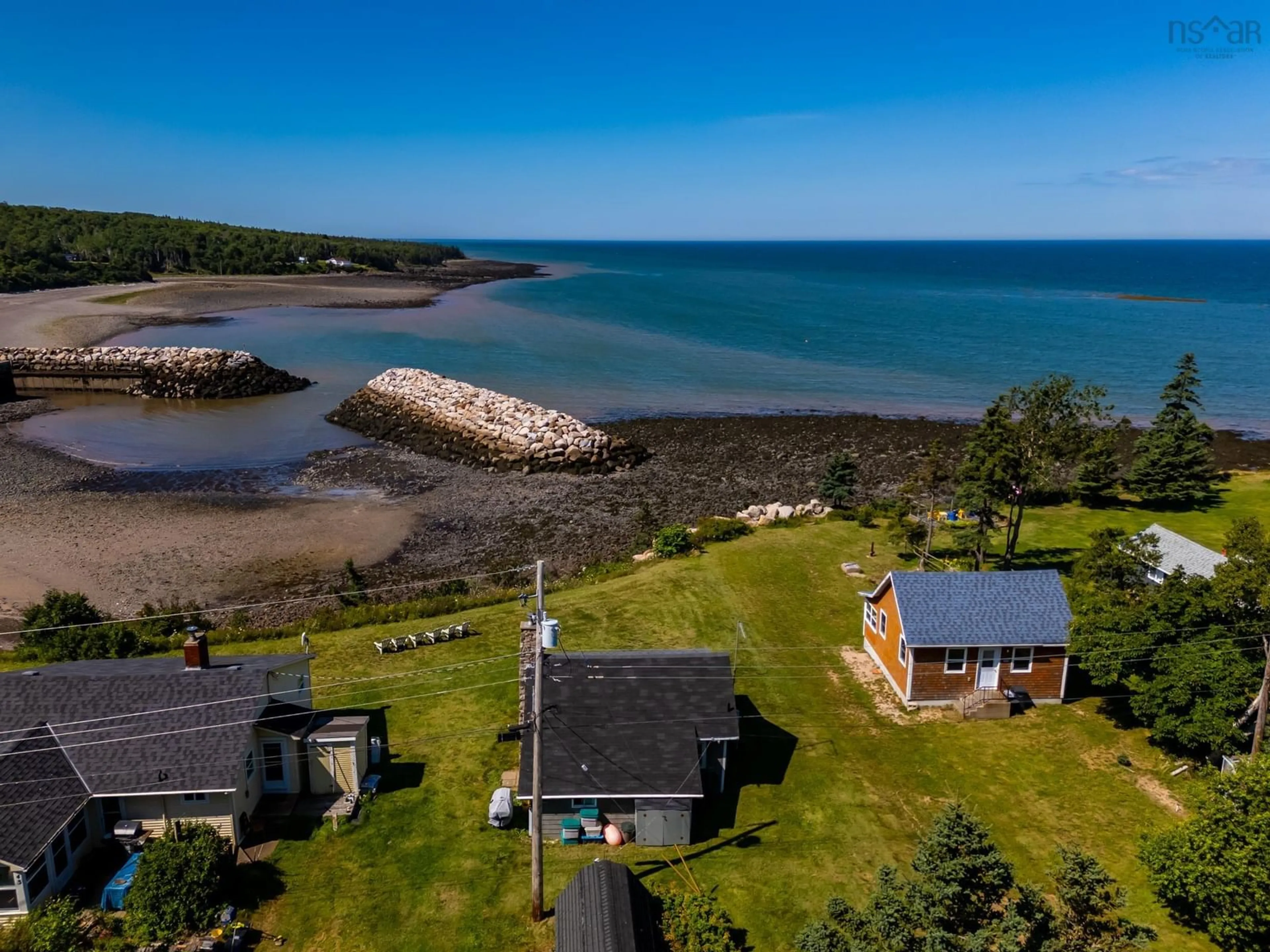 A pic from outside/outdoor area/front of a property/back of a property/a pic from drone, water/lake/river/ocean view for 147 Hampton Wharf Rd, Hampton Nova Scotia B0S 1L0