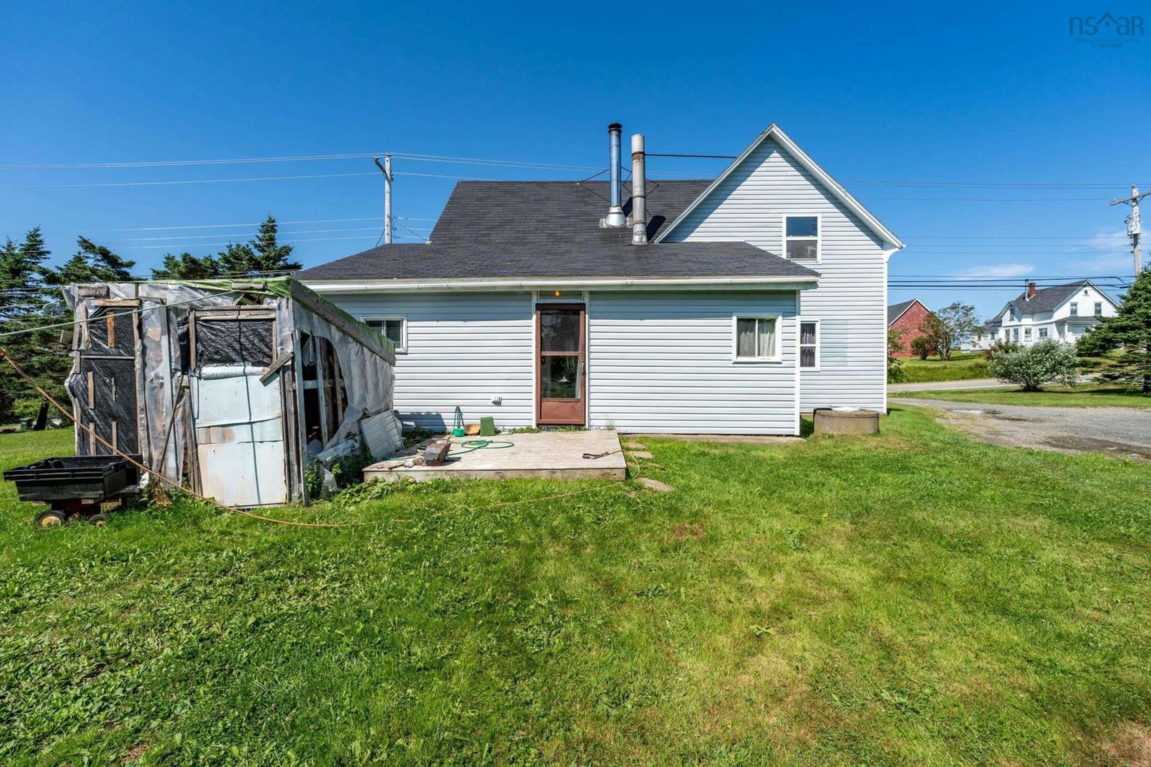 Frontside or backside of a home, the fenced backyard for 6528 Highway 1, St. Alphonse Nova Scotia B0W 2J0