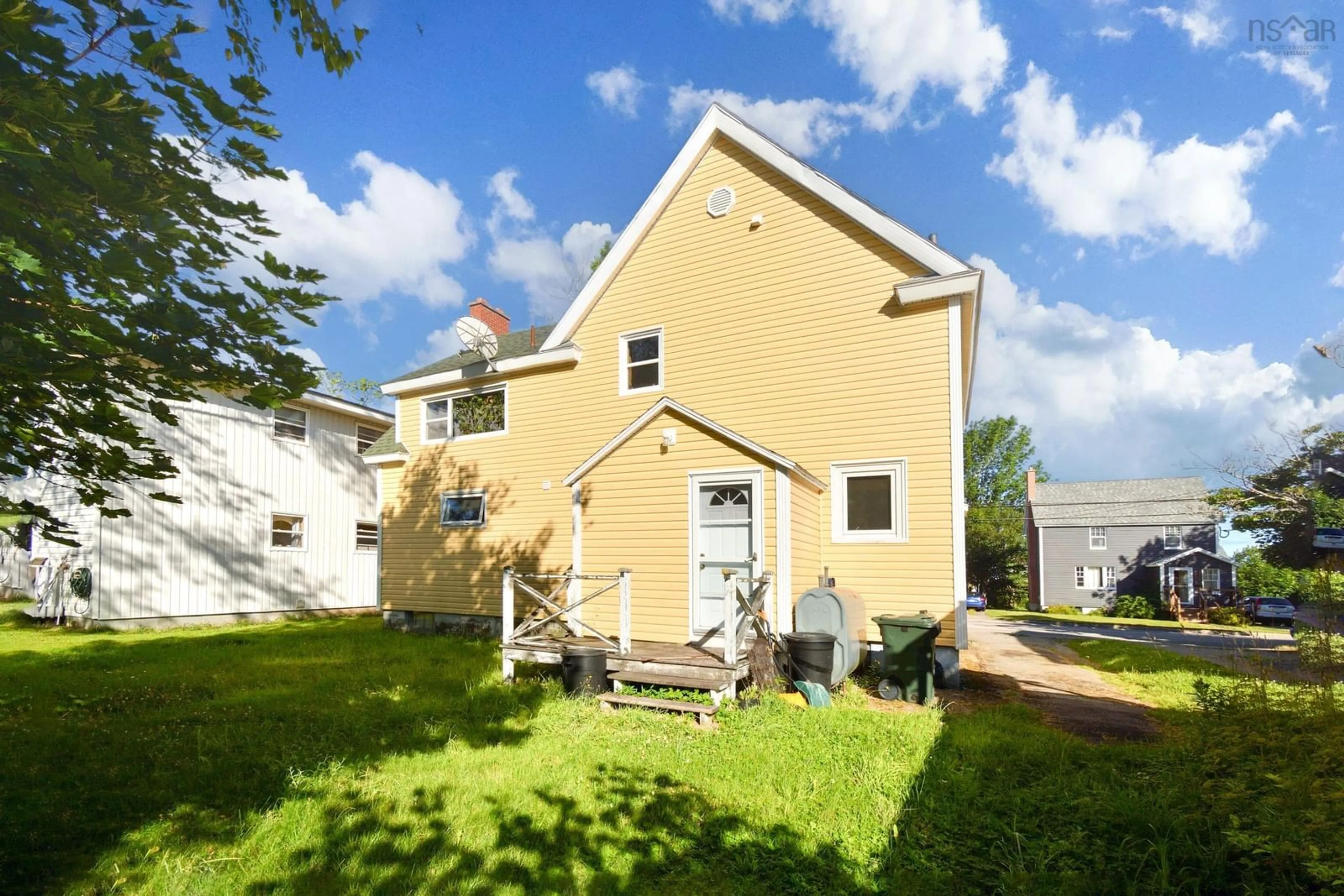 A pic from exterior of the house or condo, the fenced backyard for 242 St Peters Rd, Cape Breton Nova Scotia B1P 4R1