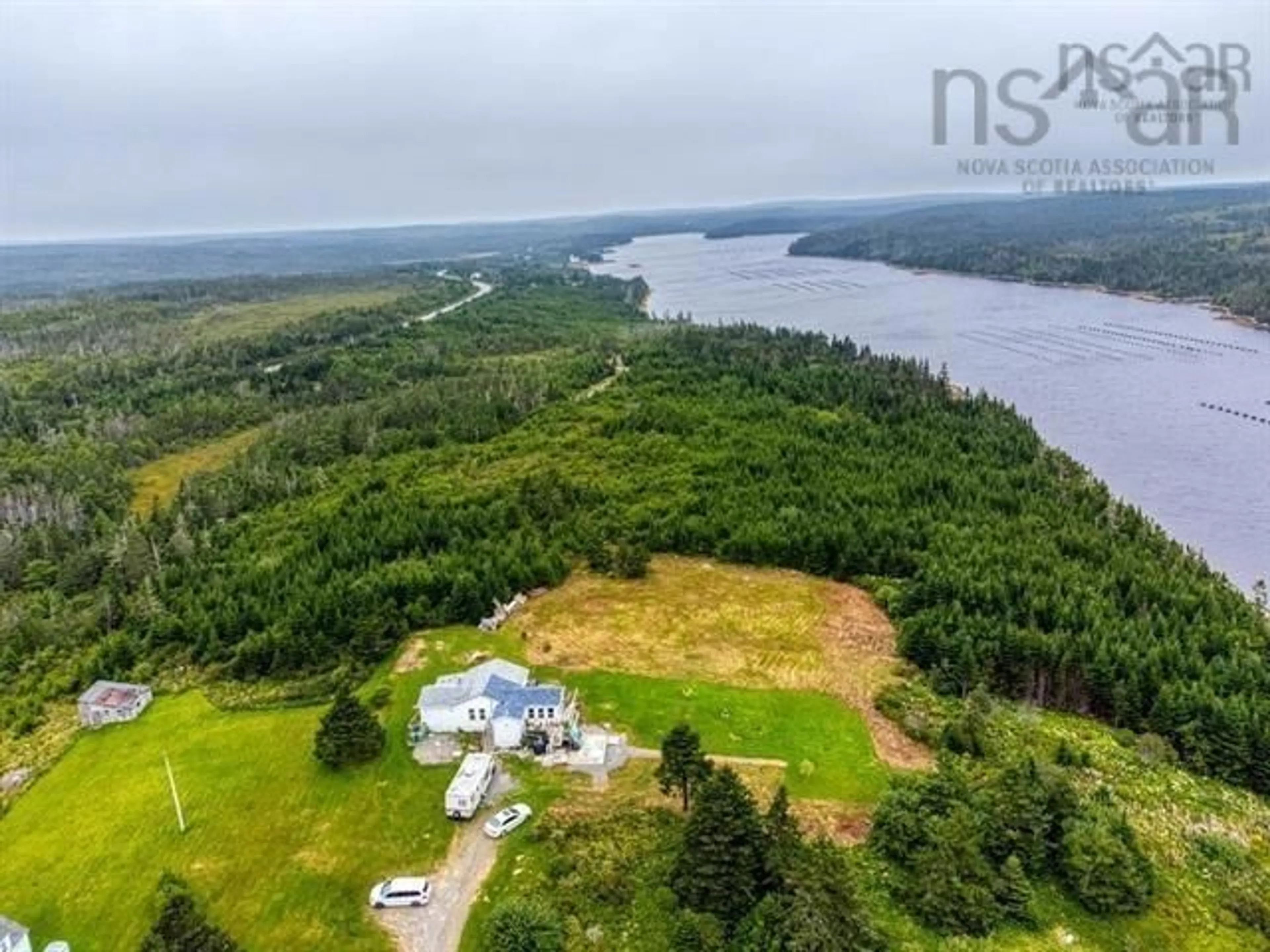 A pic from outside/outdoor area/front of a property/back of a property/a pic from drone, water/lake/river/ocean view for 59 Georges Road, Upper Whitehead Nova Scotia B0H 1T0