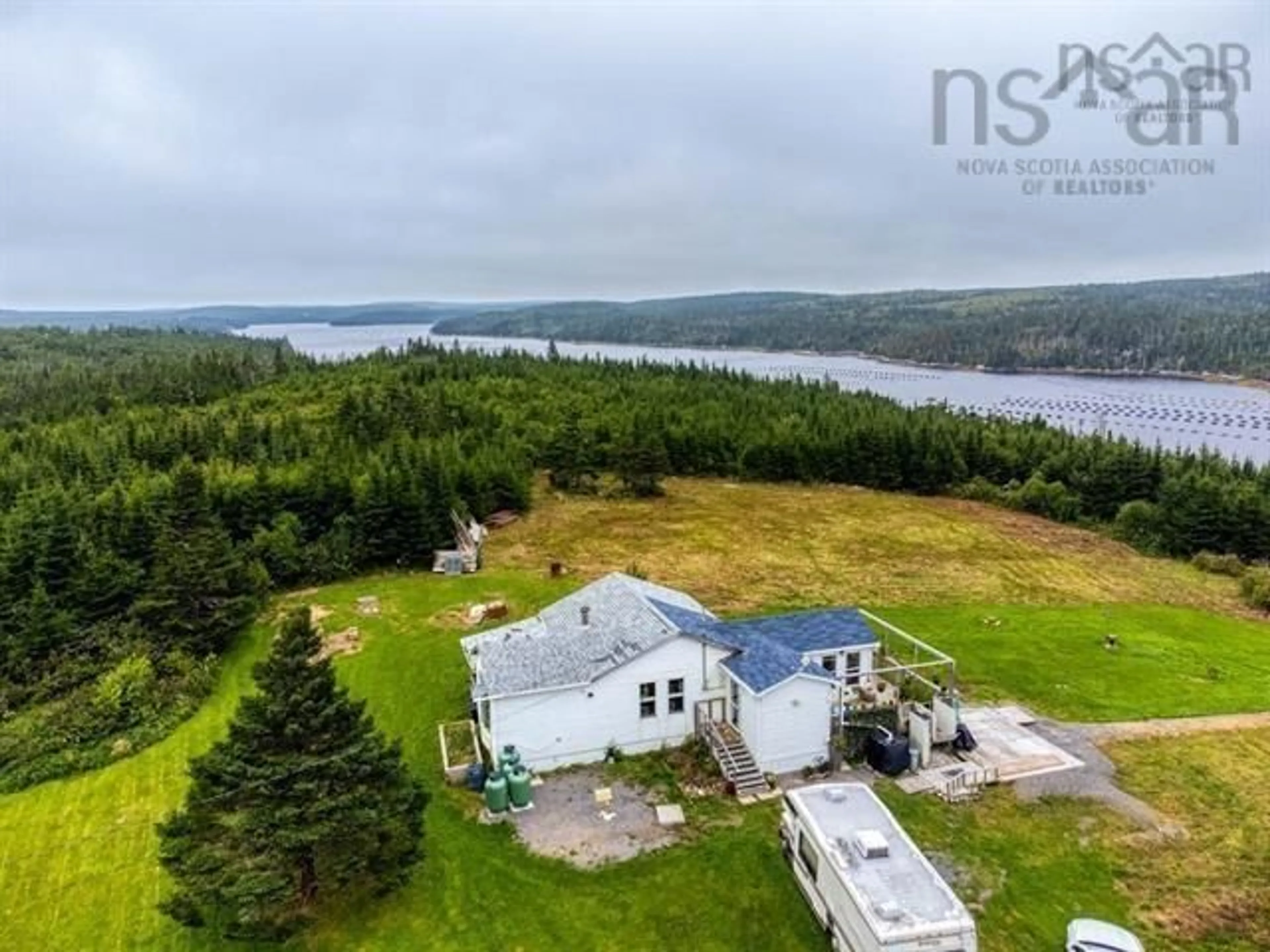 A pic from outside/outdoor area/front of a property/back of a property/a pic from drone, water/lake/river/ocean view for 59 Georges Road, Upper Whitehead Nova Scotia B0H 1T0