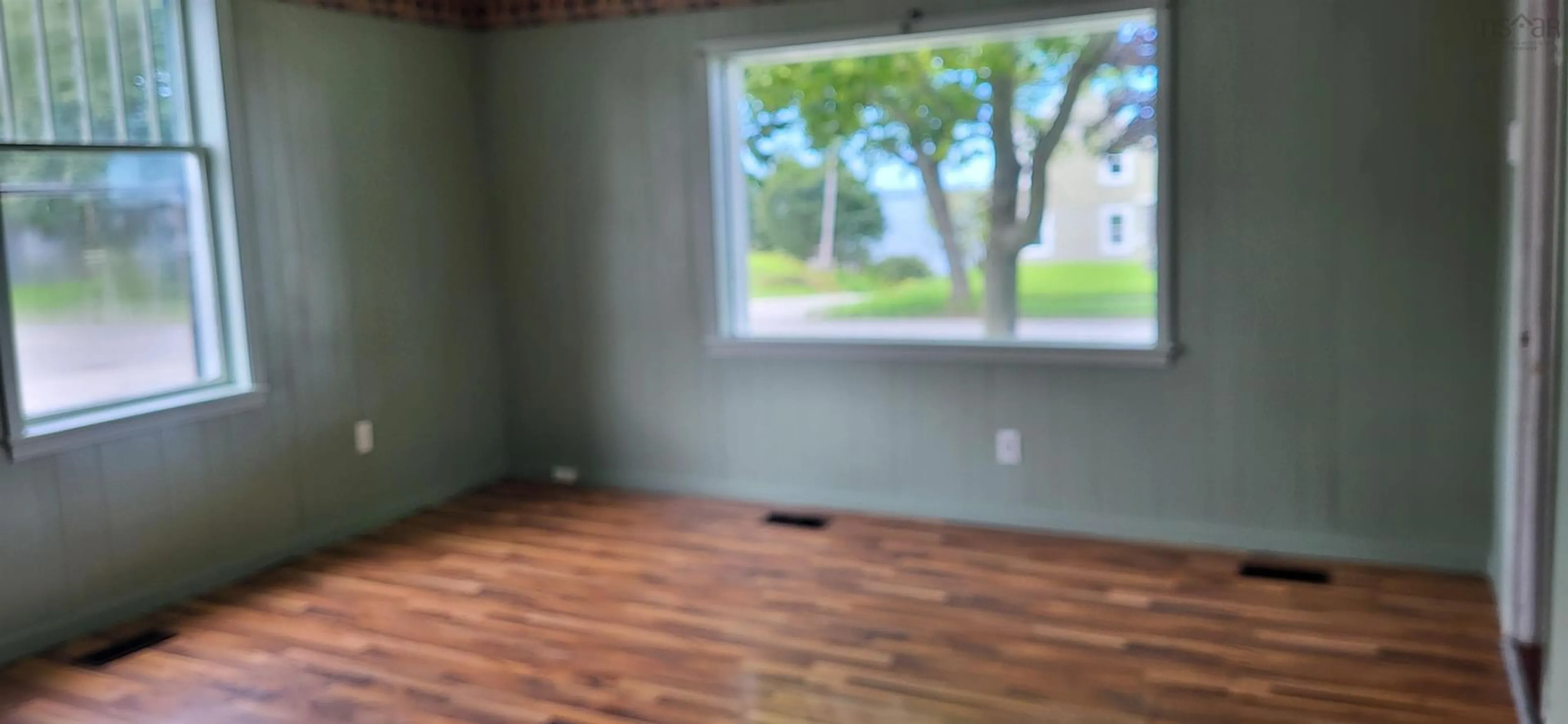 A pic of a room, wood floors for 33 Main St, Yarmouth Nova Scotia B5A 1A3