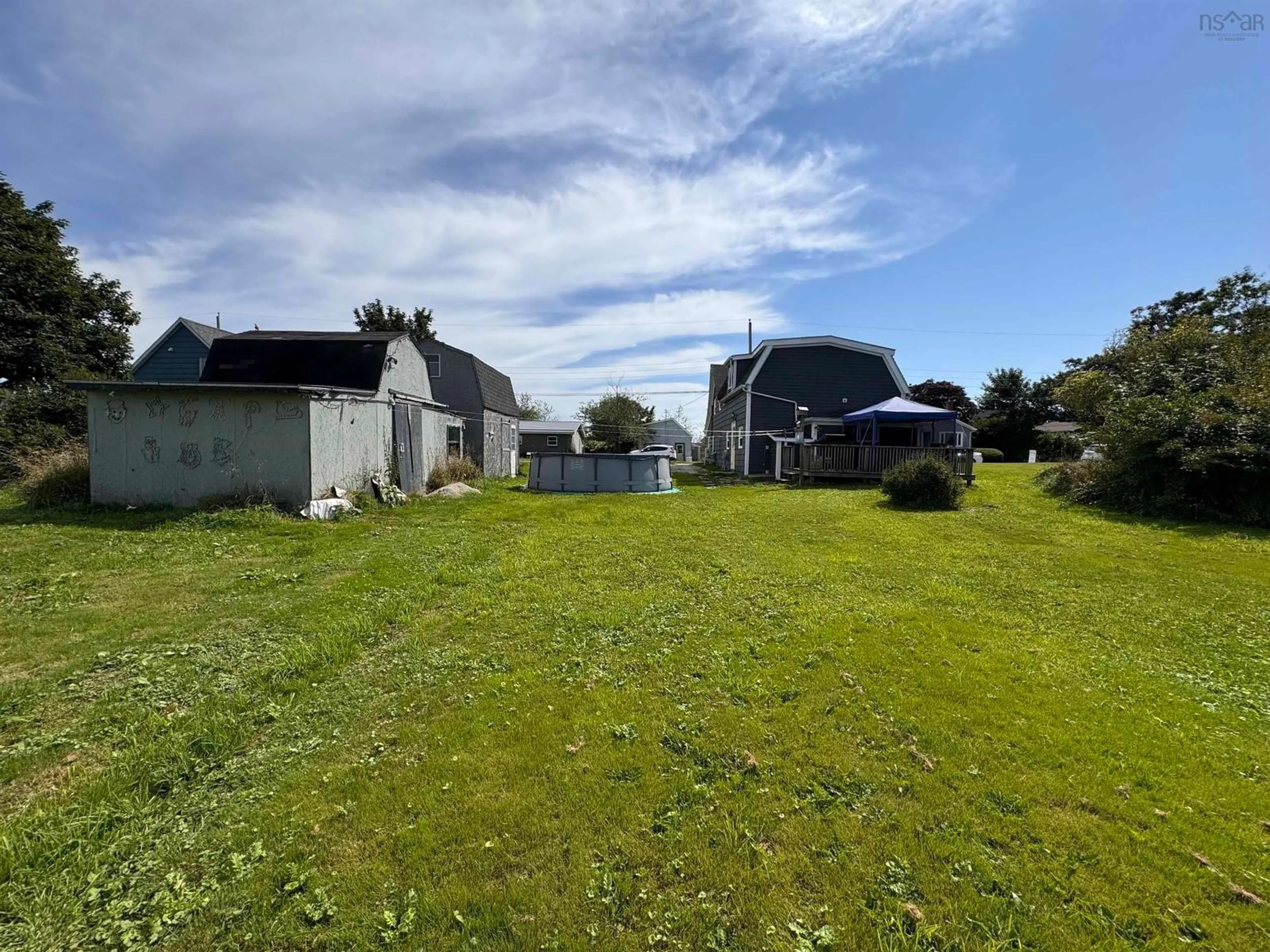 Frontside or backside of a home, the fenced backyard for 12 Church St, Yarmouth Nova Scotia B5A 3Z1