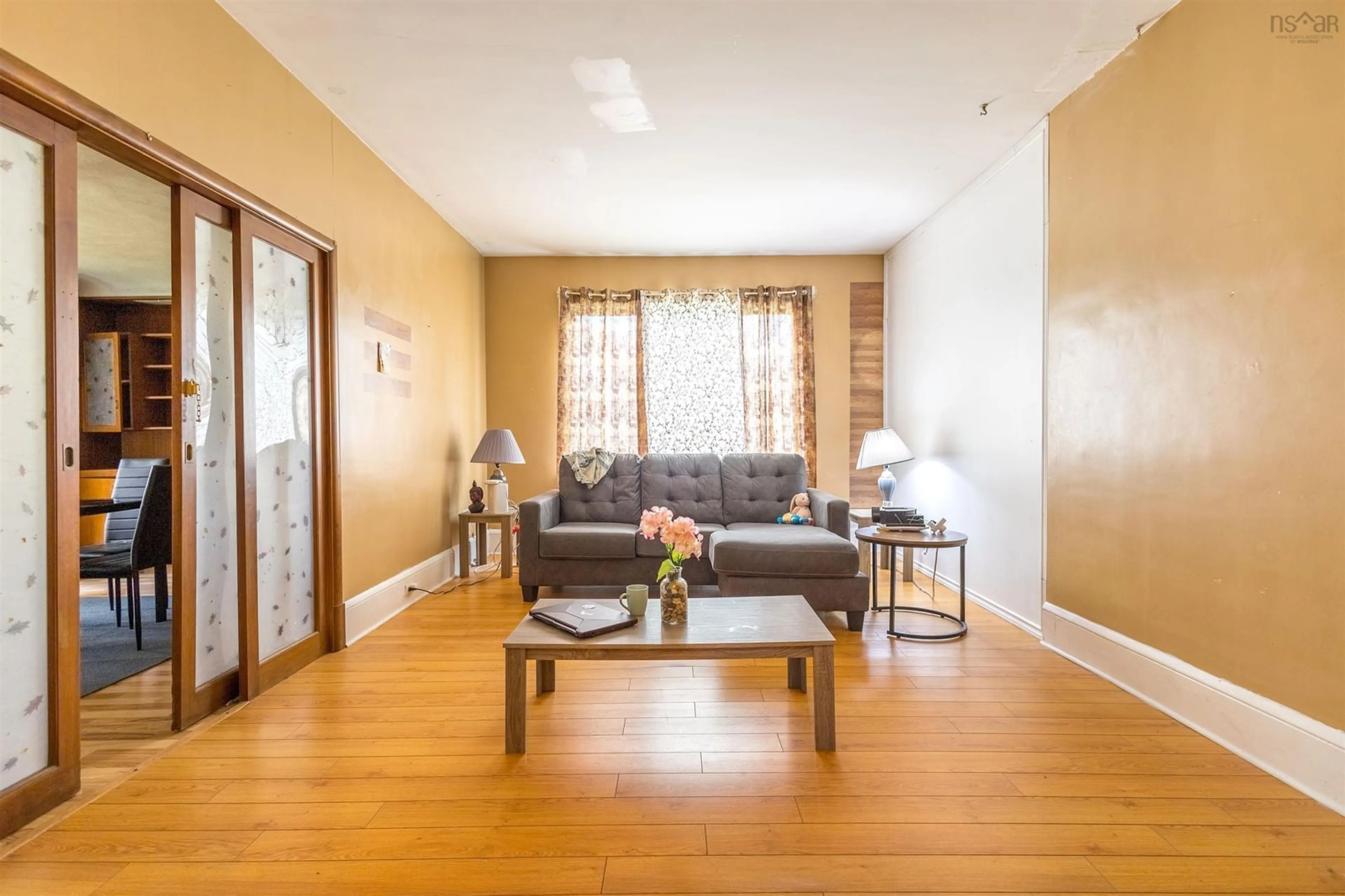 Living room with furniture, wood/laminate floor for 324 York St, Glace Bay Nova Scotia B1A 2M7