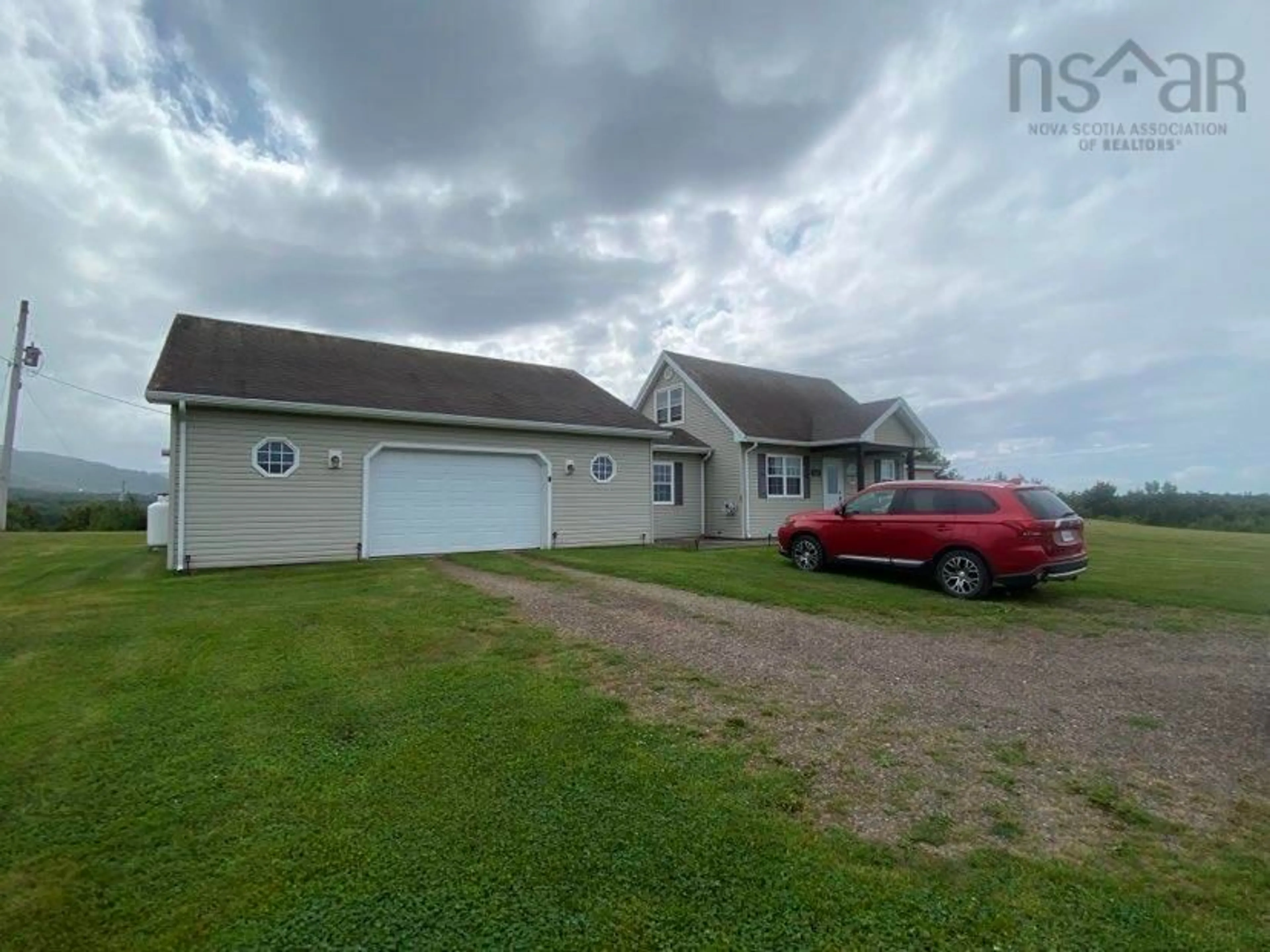 Frontside or backside of a home, the street view for 892 Cheticamp Back Rd, Belle Marche Nova Scotia B0E 1H0