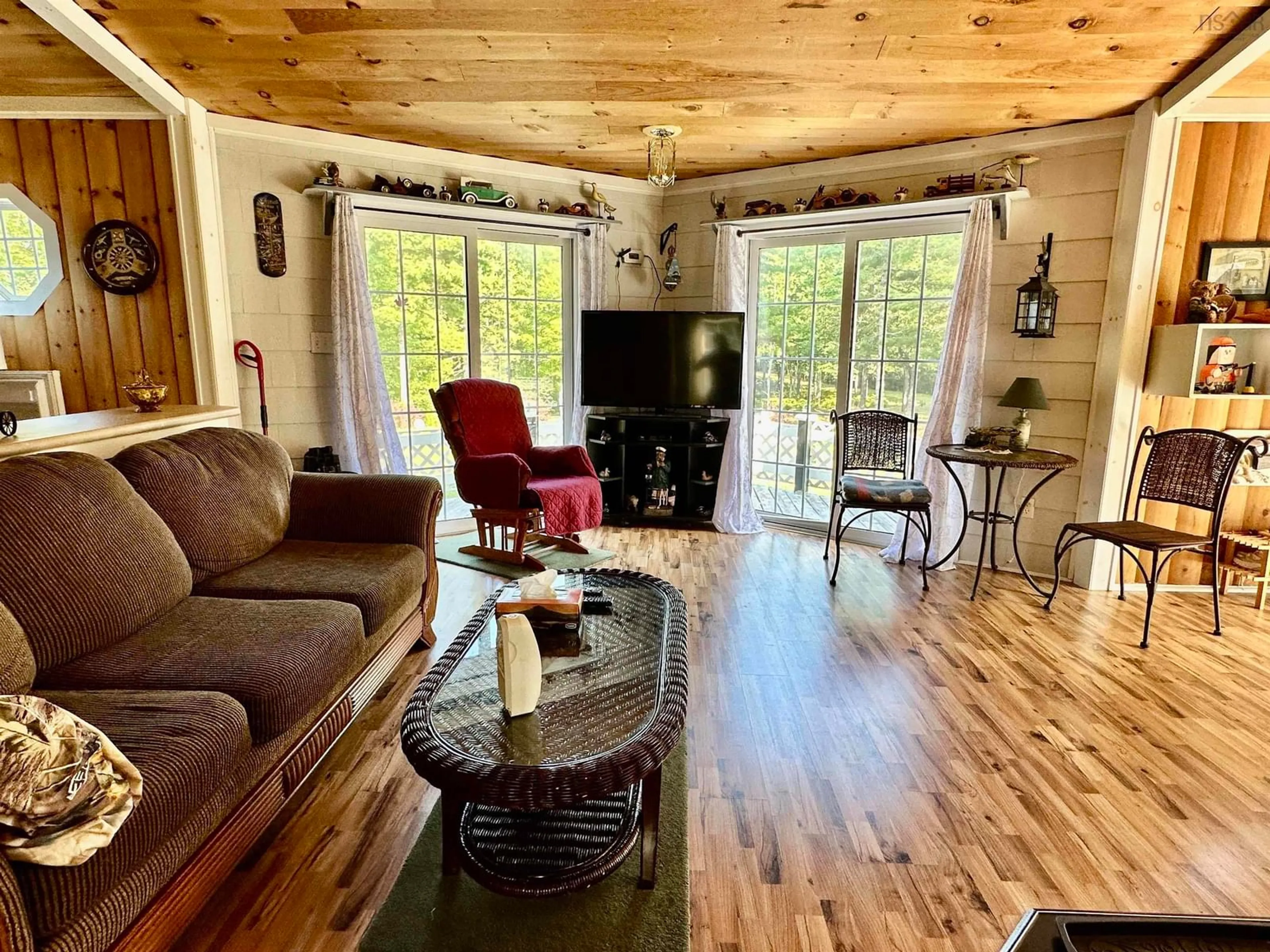 Living room with furniture, wood/laminate floor for 26 Red Beaver Rd, Middlefield Nova Scotia B0T 1E0