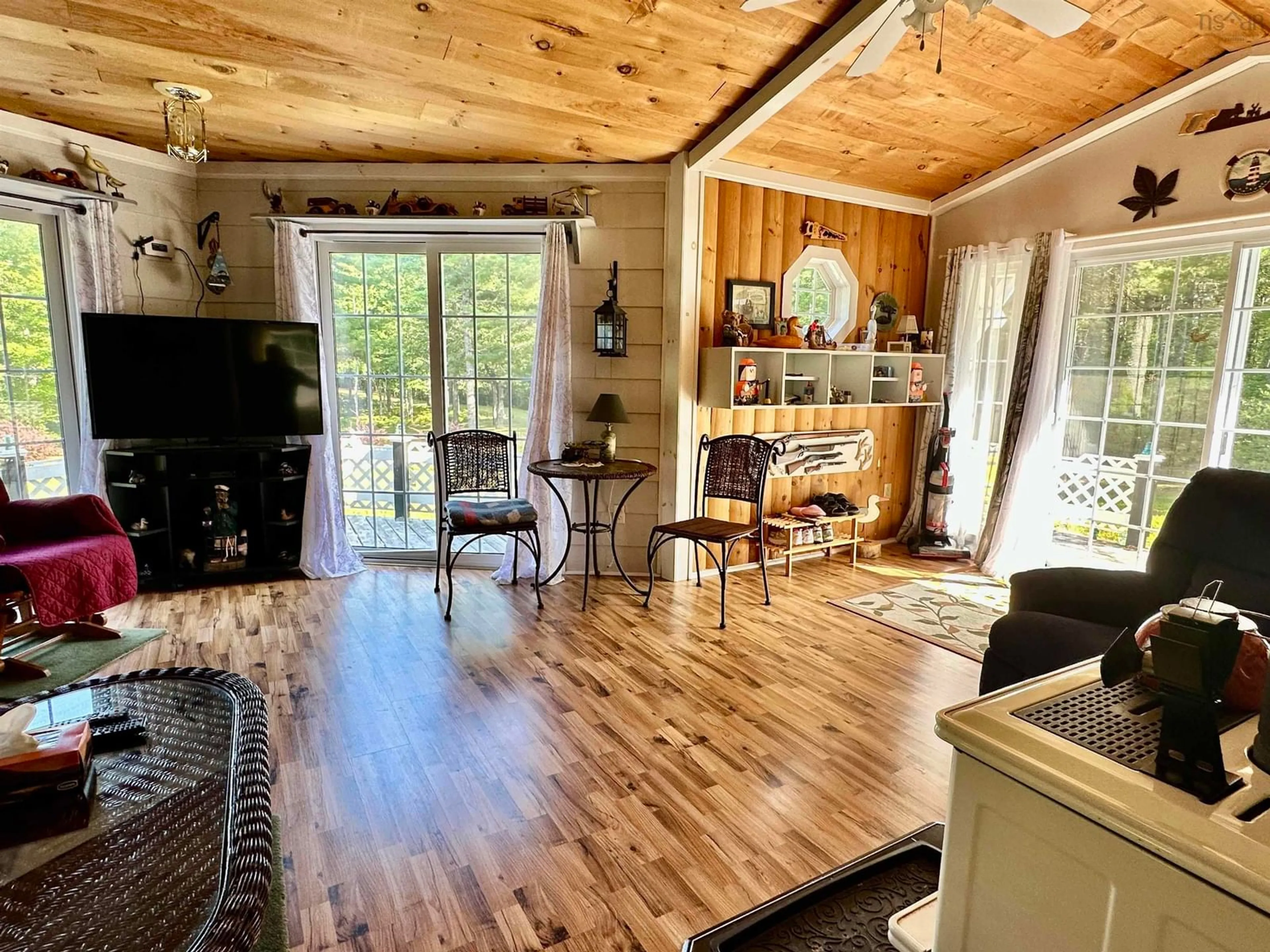 Living room with furniture, wood/laminate floor for 26 Red Beaver Rd, Middlefield Nova Scotia B0T 1E0