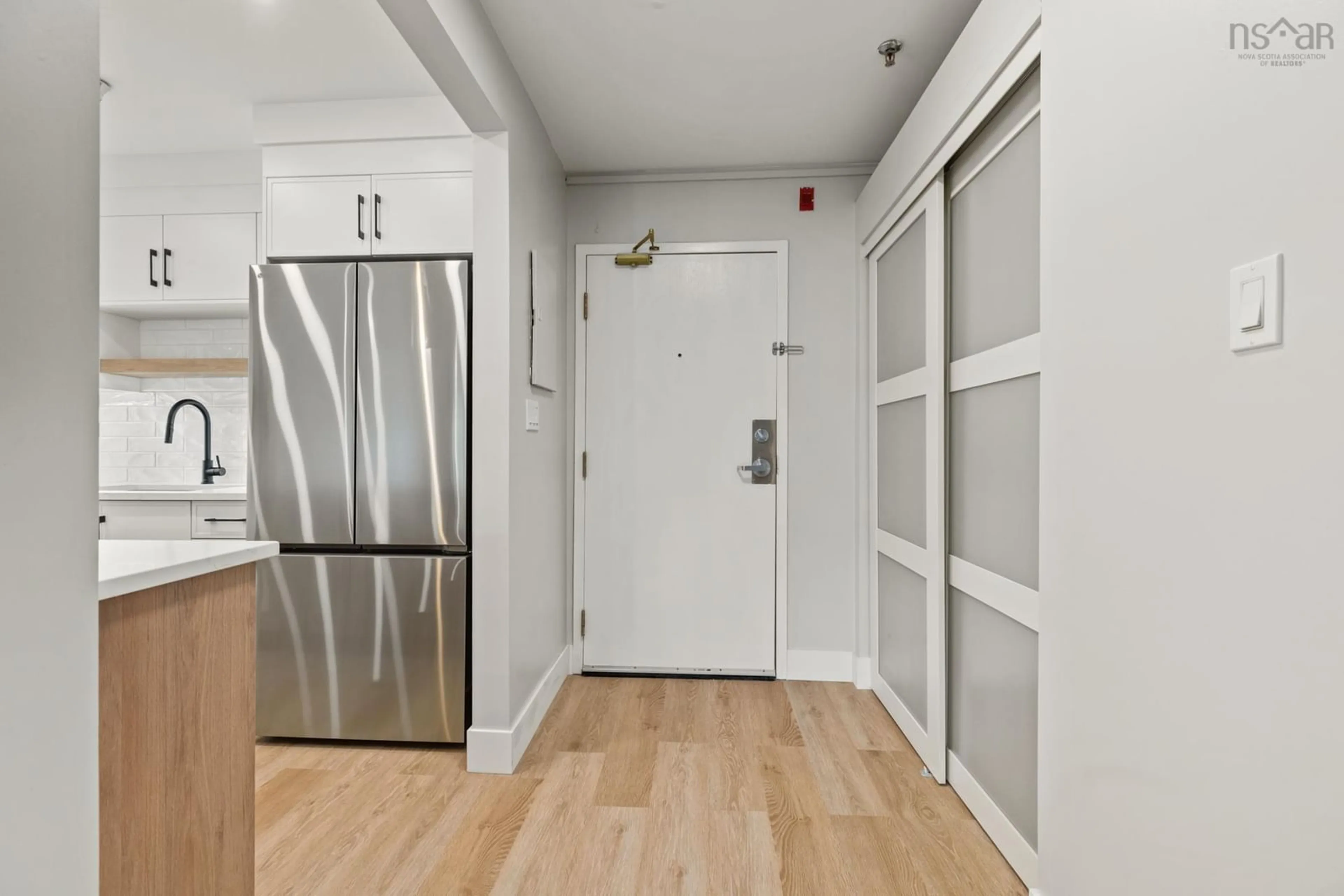 Indoor entryway, wood floors for 31 River Lane #101, Bedford Nova Scotia B4A 3Y7