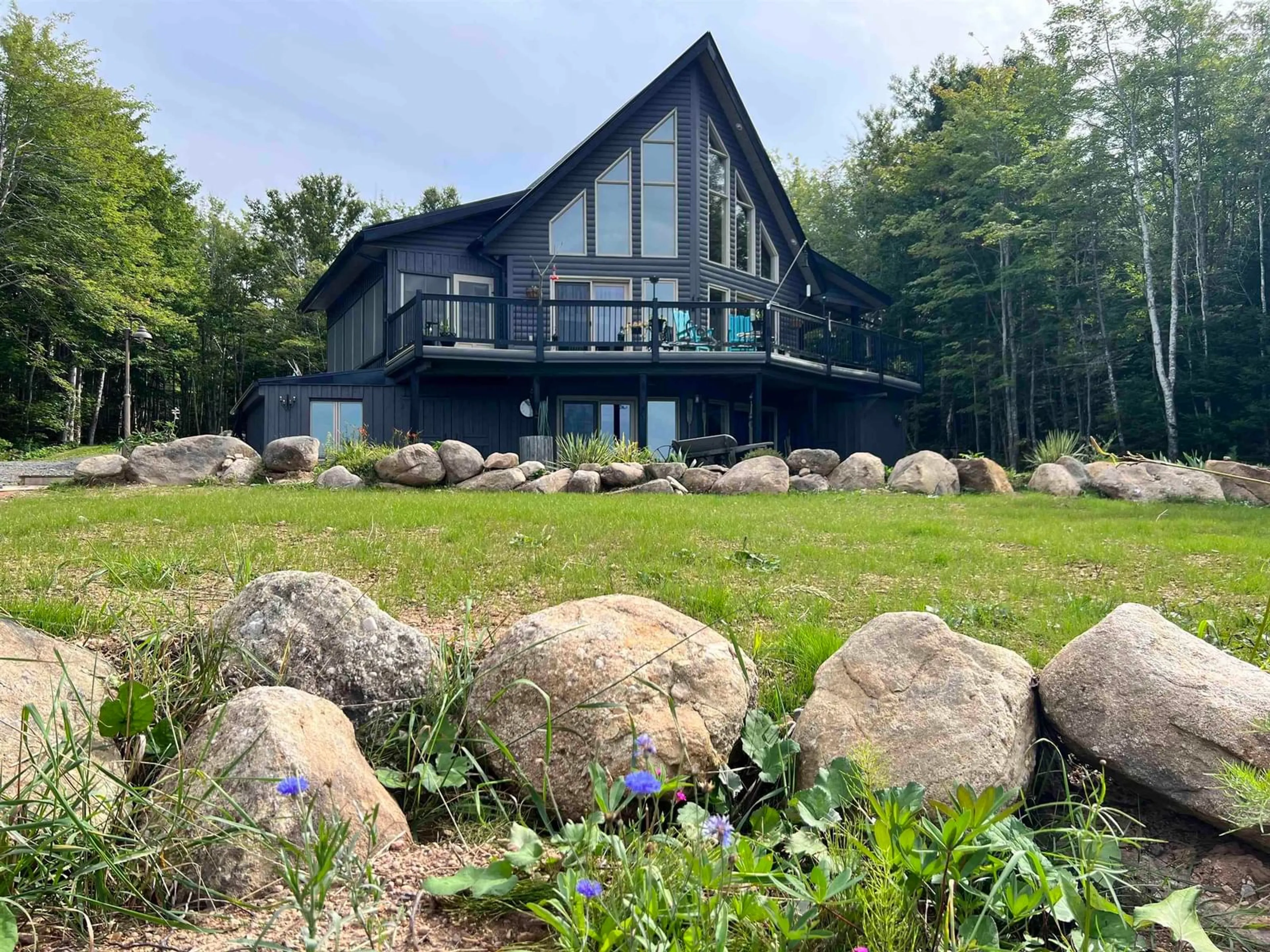 A pic from outside/outdoor area/front of a property/back of a property/a pic from drone, water/lake/river/ocean view for 152 Mersey Rd, Inlet Baddeck Nova Scotia B0E 1B0