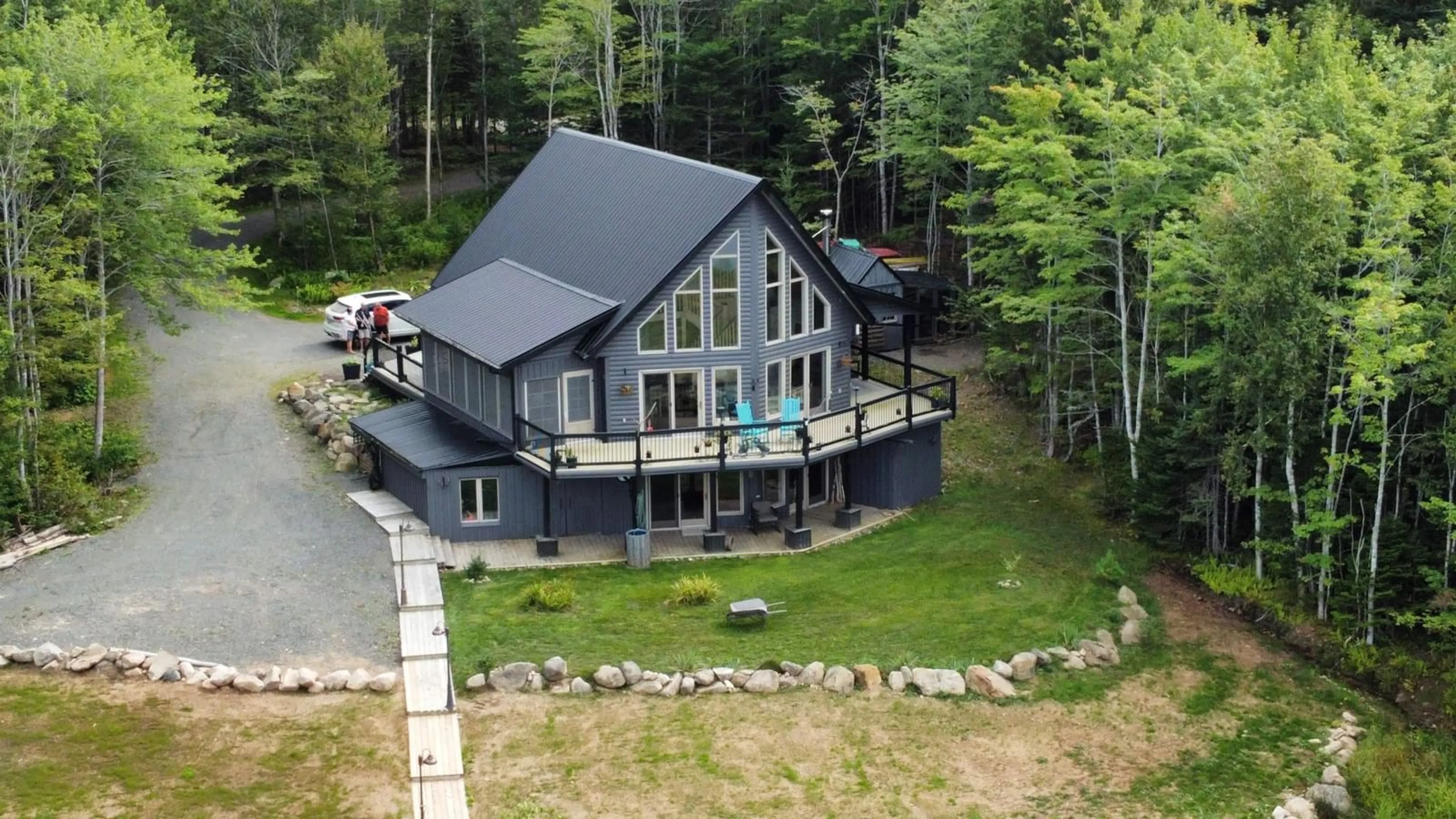 A pic from outside/outdoor area/front of a property/back of a property/a pic from drone, unknown for 152 Mersey Rd, Inlet Baddeck Nova Scotia B0E 1B0